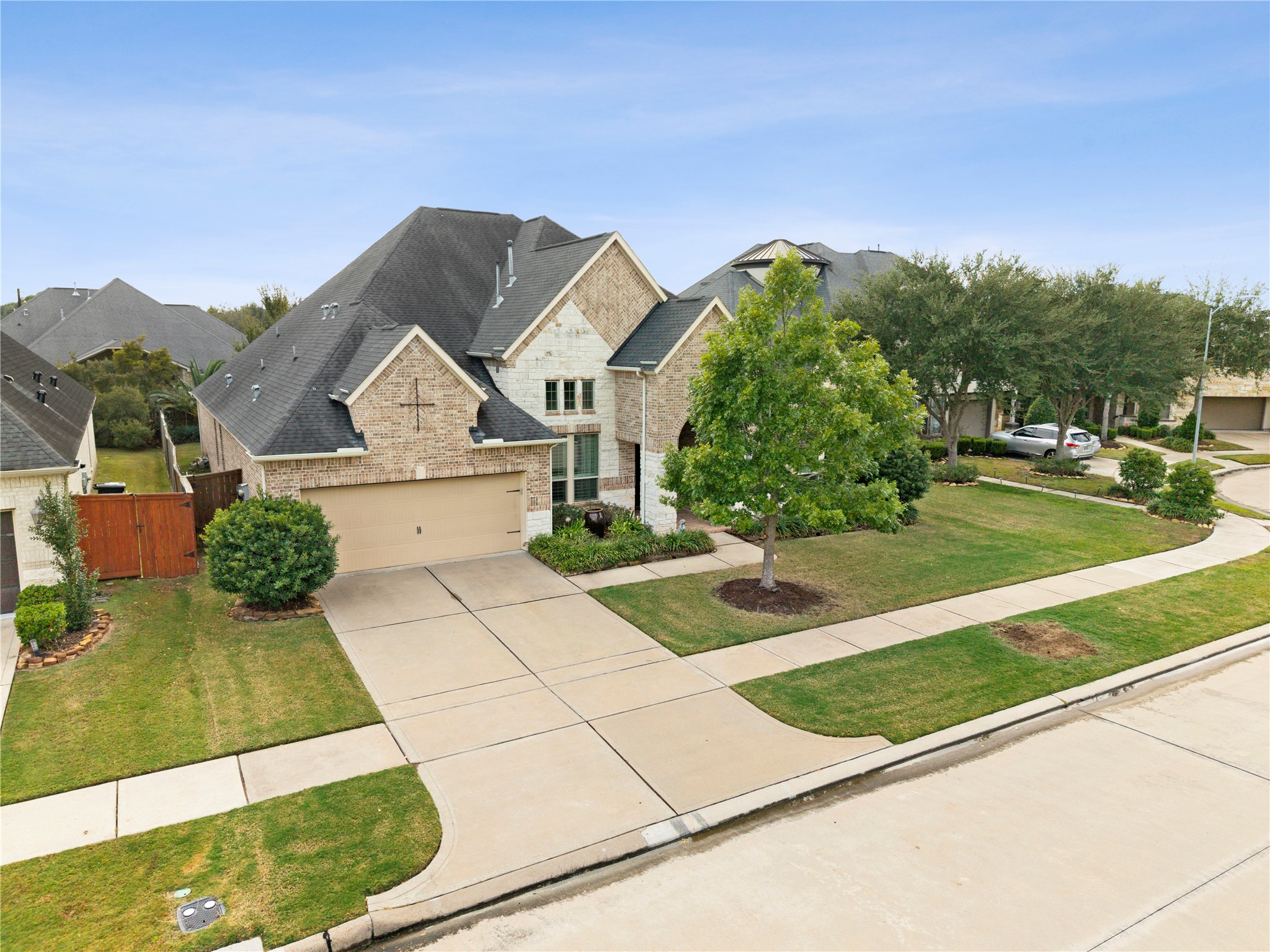 Stately brick home with a two-car garage, manicured lawn, and charming curb appeal nestled in a serene suburban neighborhood. Stately brick home with a two-car garage, manicured lawn, and charming curb appeal nestled in a serene suburban neighborhood.