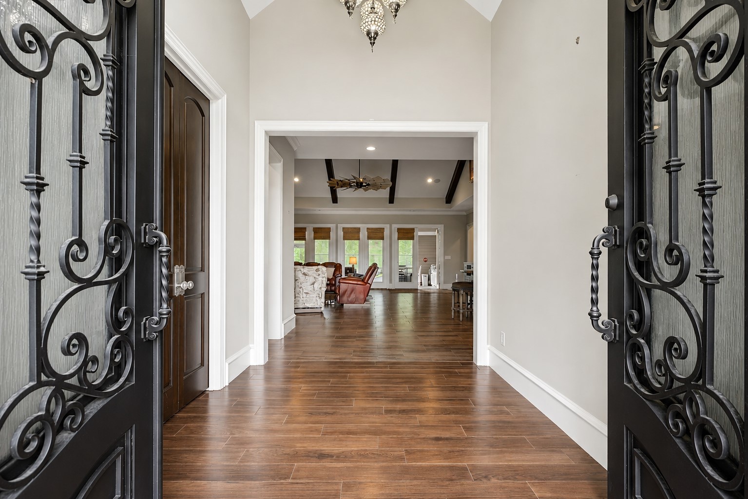 Step through the grand double front doors into a welcoming foyer that sets the tone for the elegance found throughout the home. Step through the grand double front doors into a welcoming foyer that sets the tone for the elegance found throughout the home.