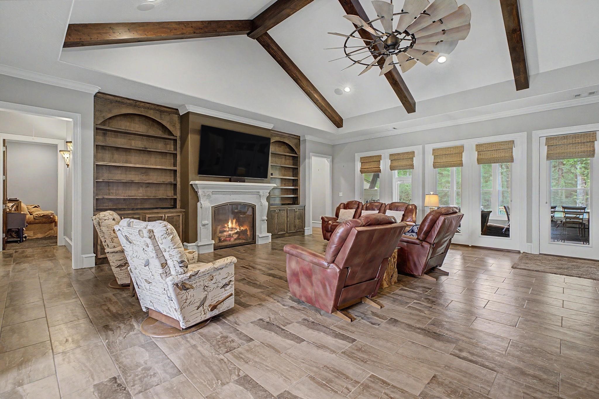 Your New Favorite Spot - Relax by the gas fireplace surrounded by stylish living room built-ins, perfect for year-round comfort. Your New Favorite Spot - Relax by the gas fireplace surrounded by stylish living room built-ins, perfect for year-round comfort.