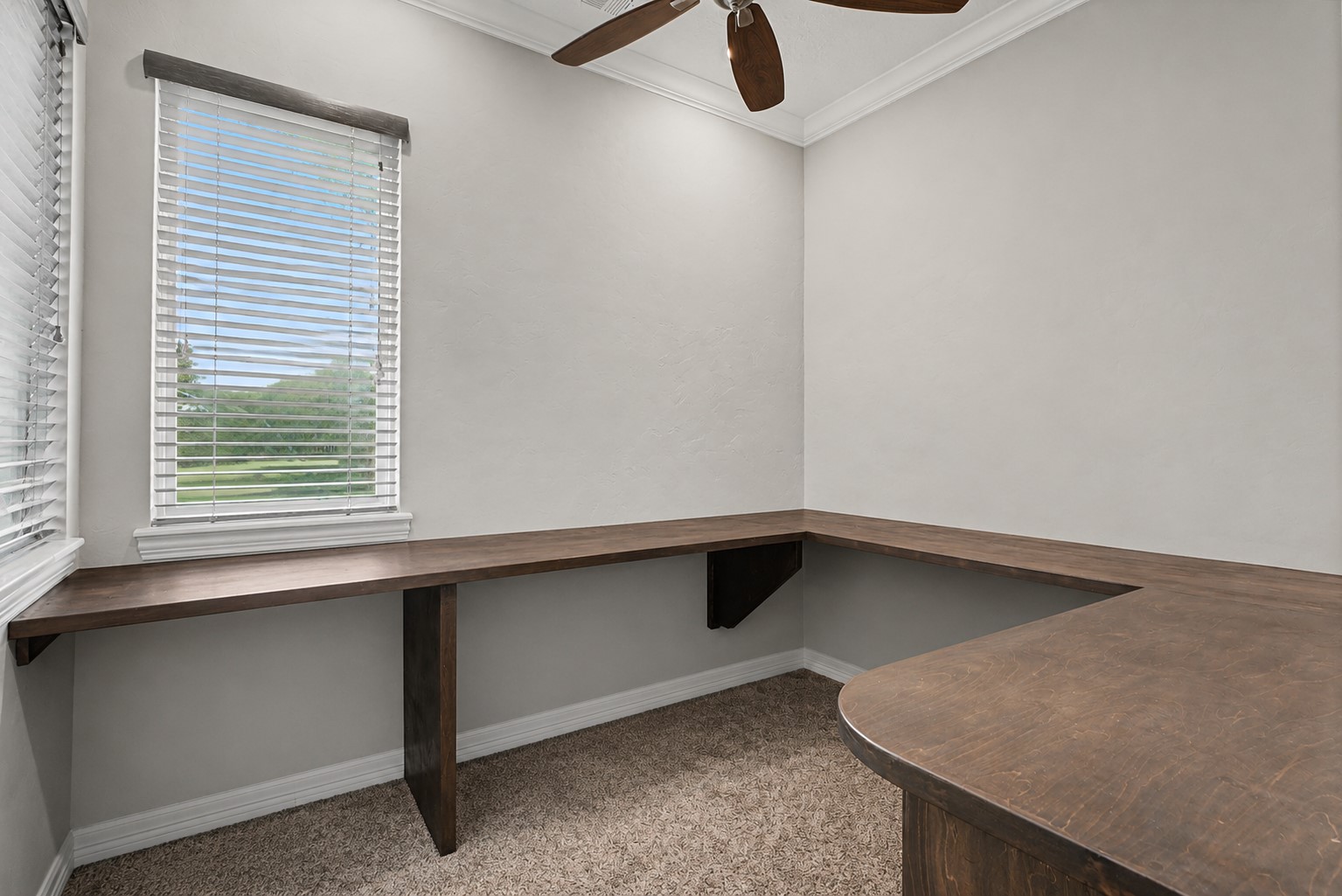 This unique office space is located within the primary suite's walk-in closet, offering a private and convenient workspace. An additional office is located near the front of the home, providing flexibility for multiple workstations or hobbies.