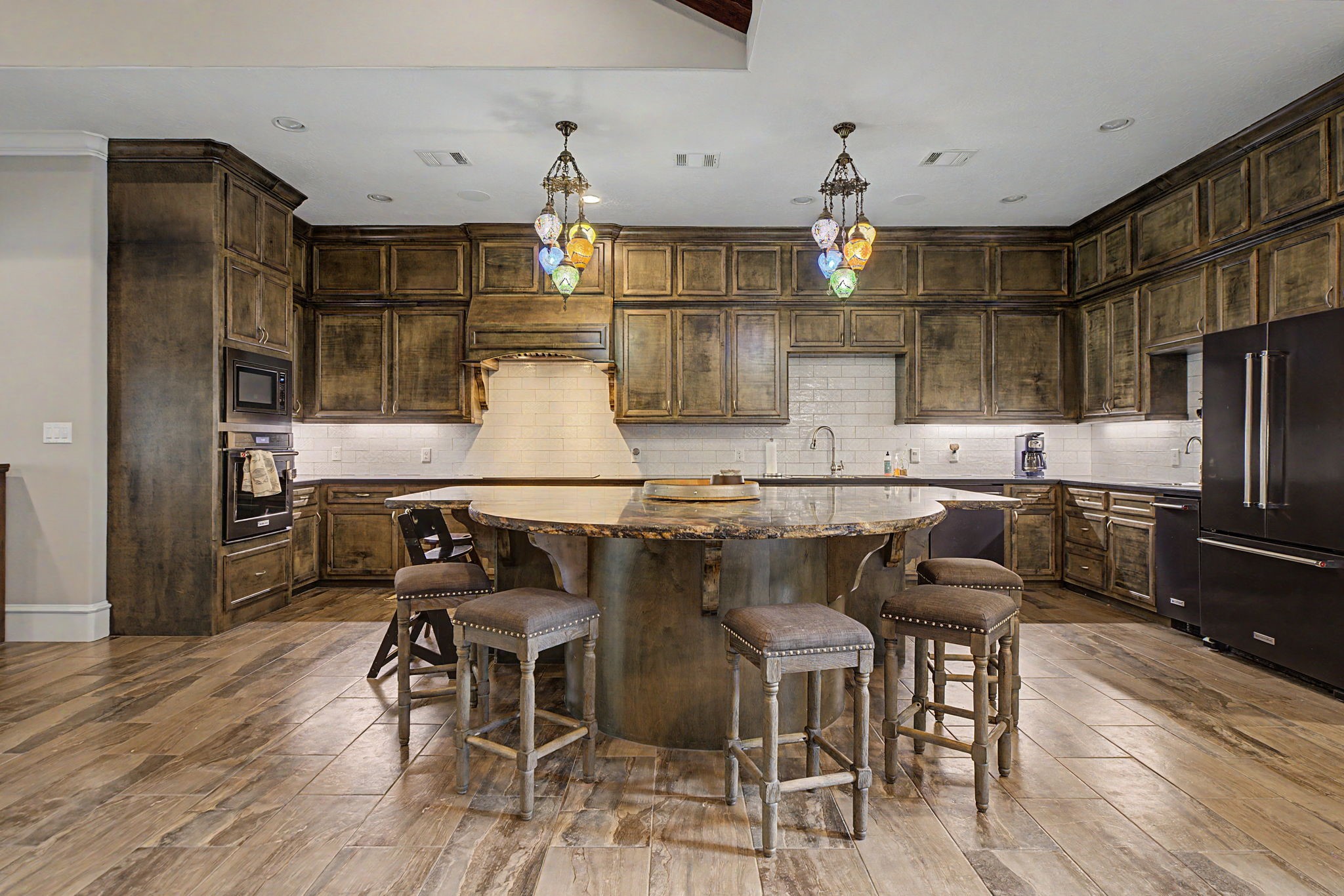 This well-appointed kitchen features stainless steel appliances and is plumbed for gas, offering flexibility for future appliance upgrades.