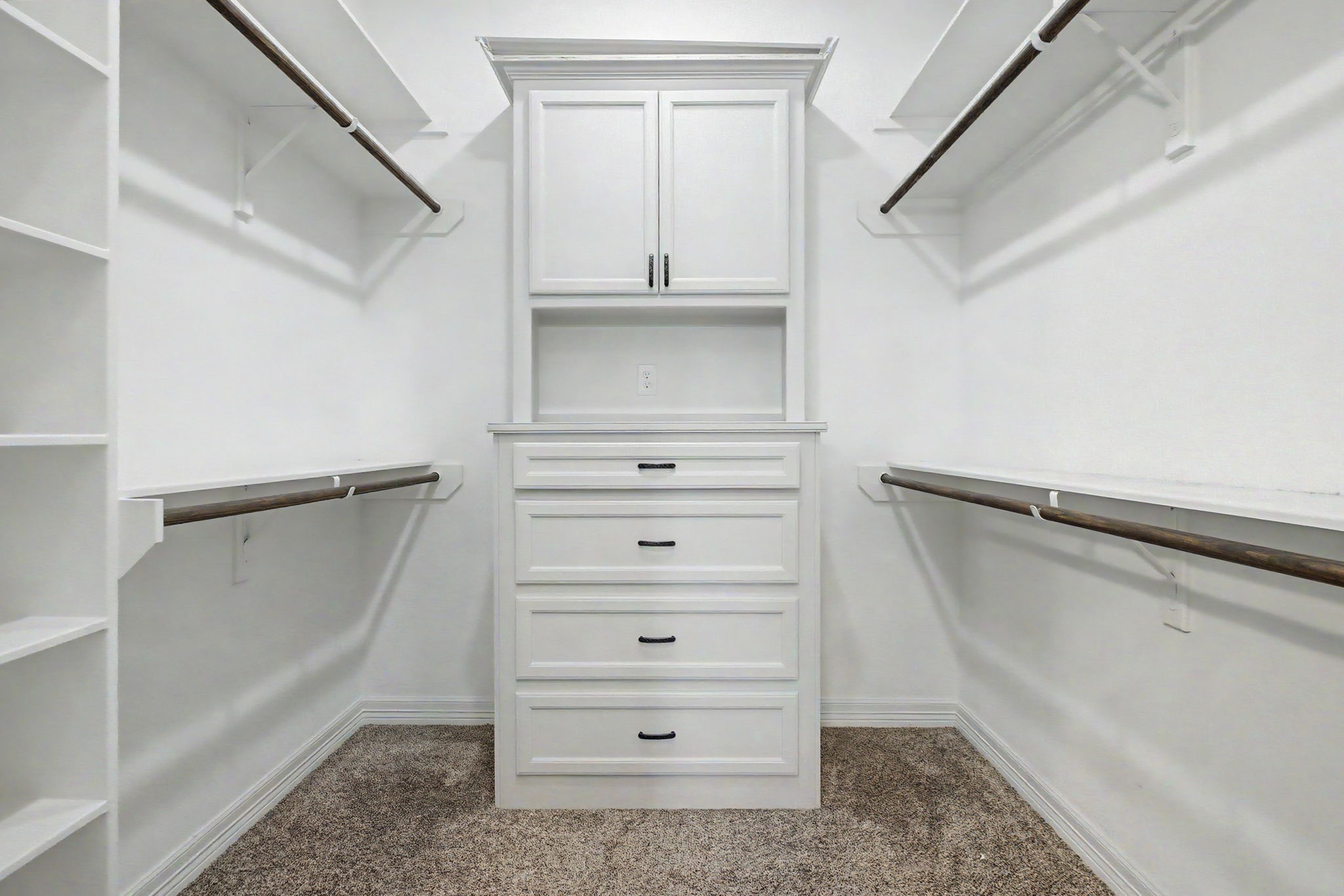 Primary Walk-In Closet #2 features custom built-ins and abundant storage space, helping keep everything neatly organized.