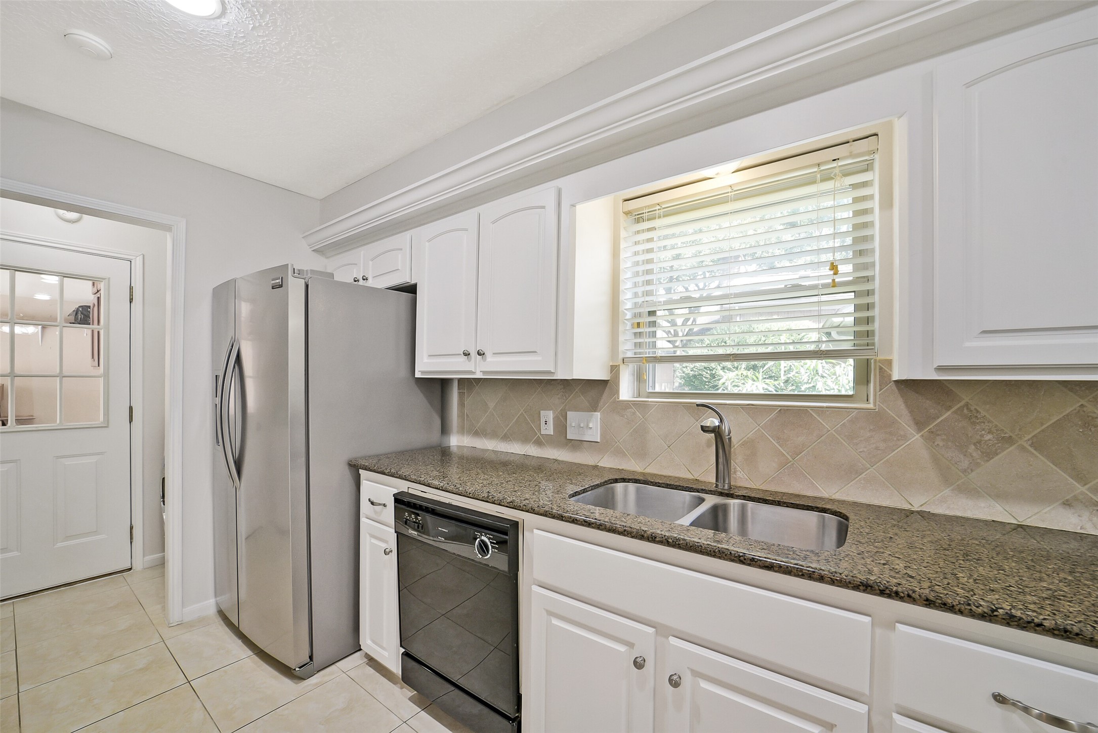 The kitchen also has a Maytag dishwasher, SS refrigerator and double basin sink.