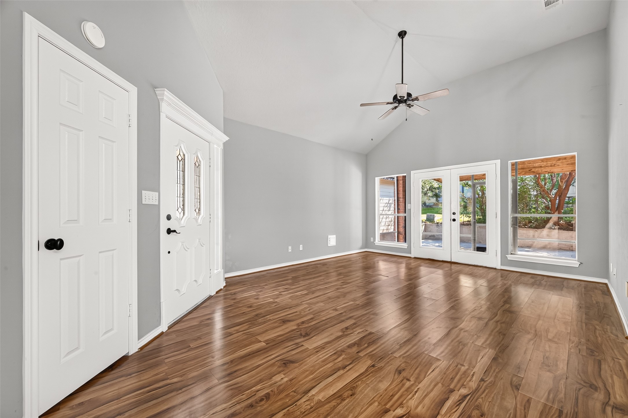 Additional view of living room and screened porch