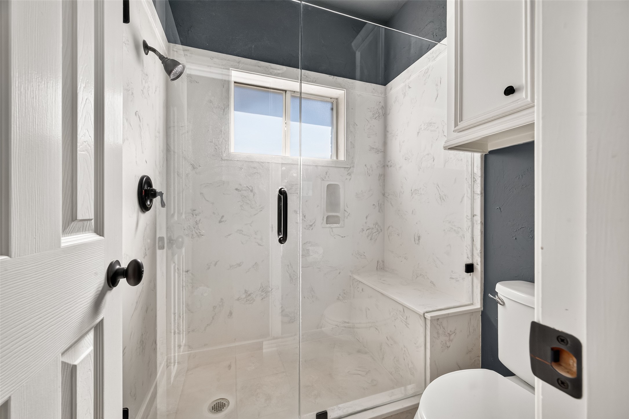 Spacious shower with built in seat