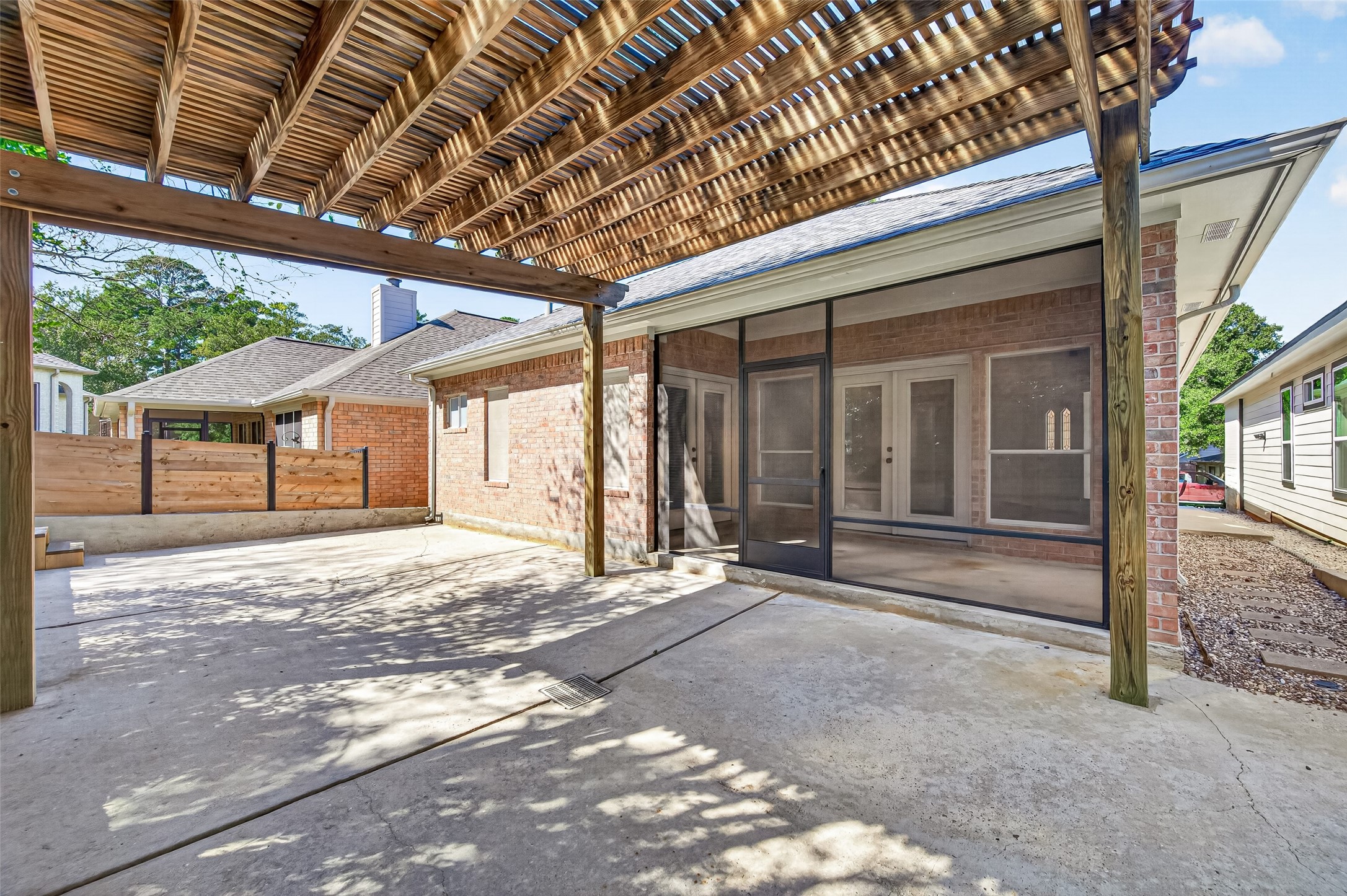 Spacious patio with screened porch