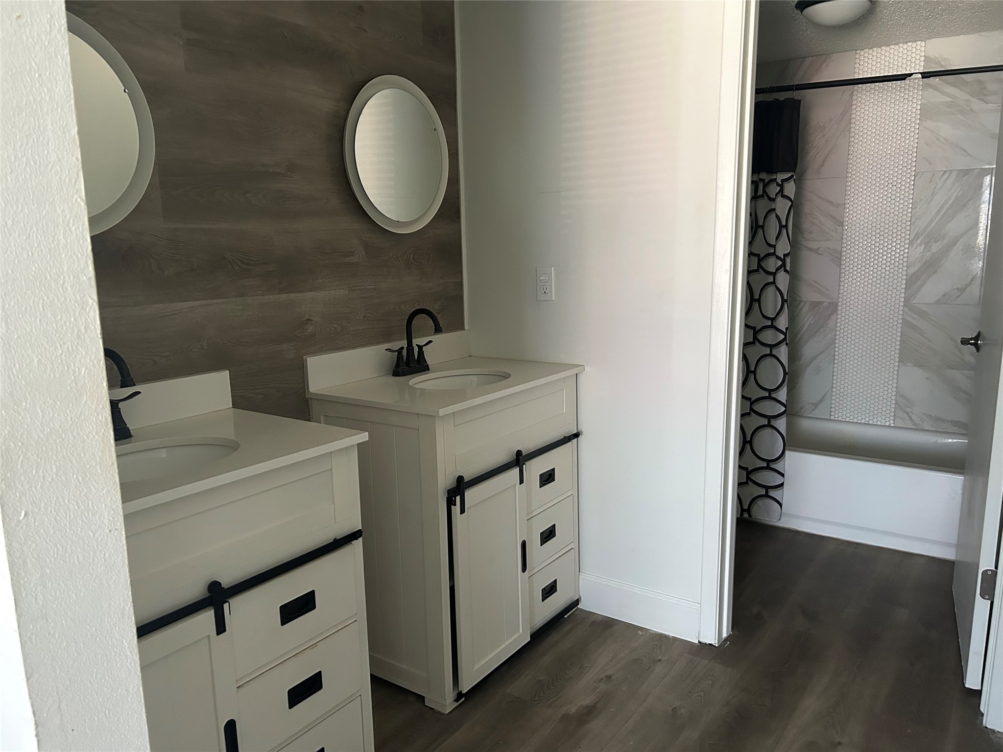 Master bath with double sink and shower and tub.