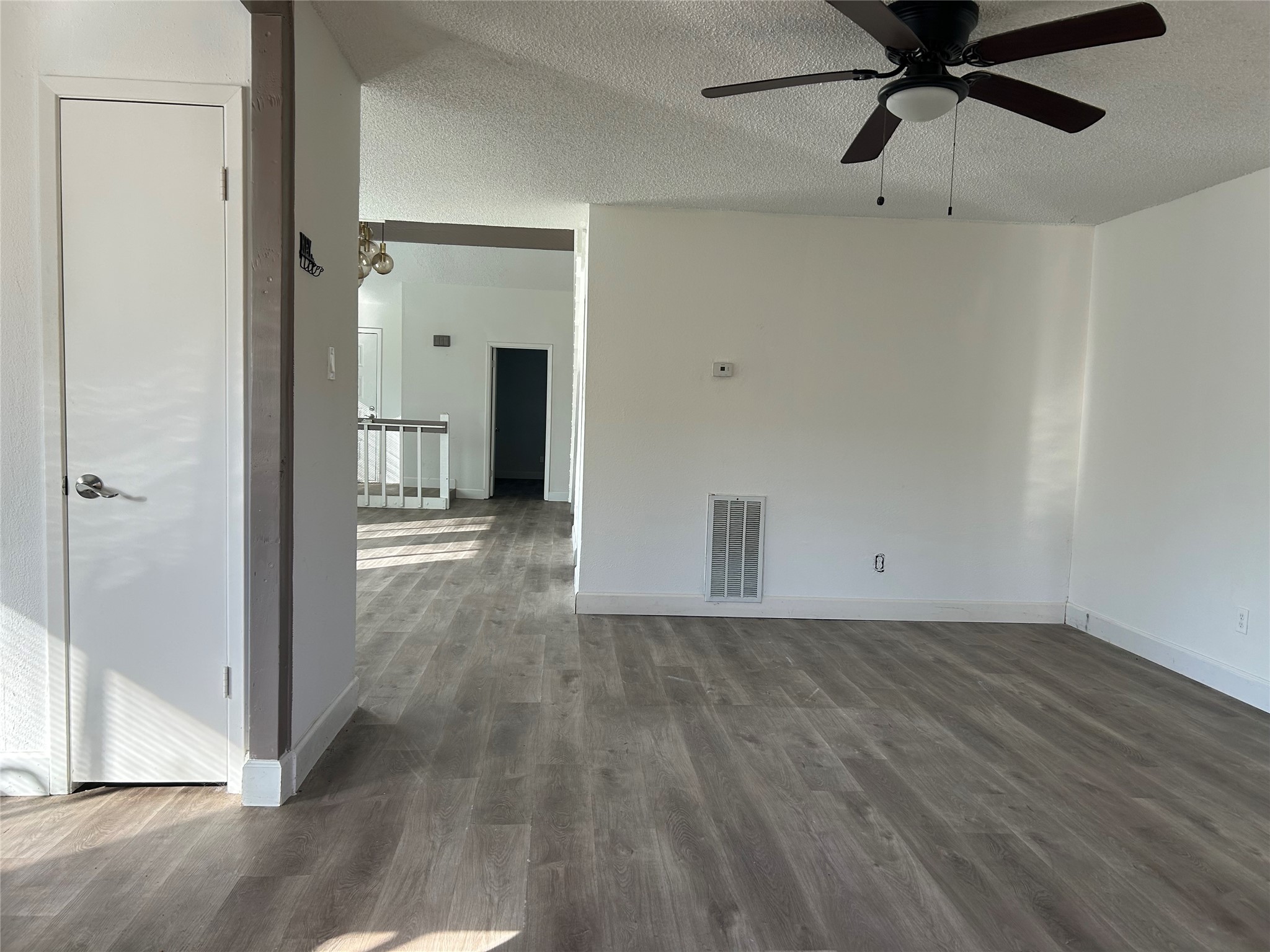 Large family room with ceiling fan