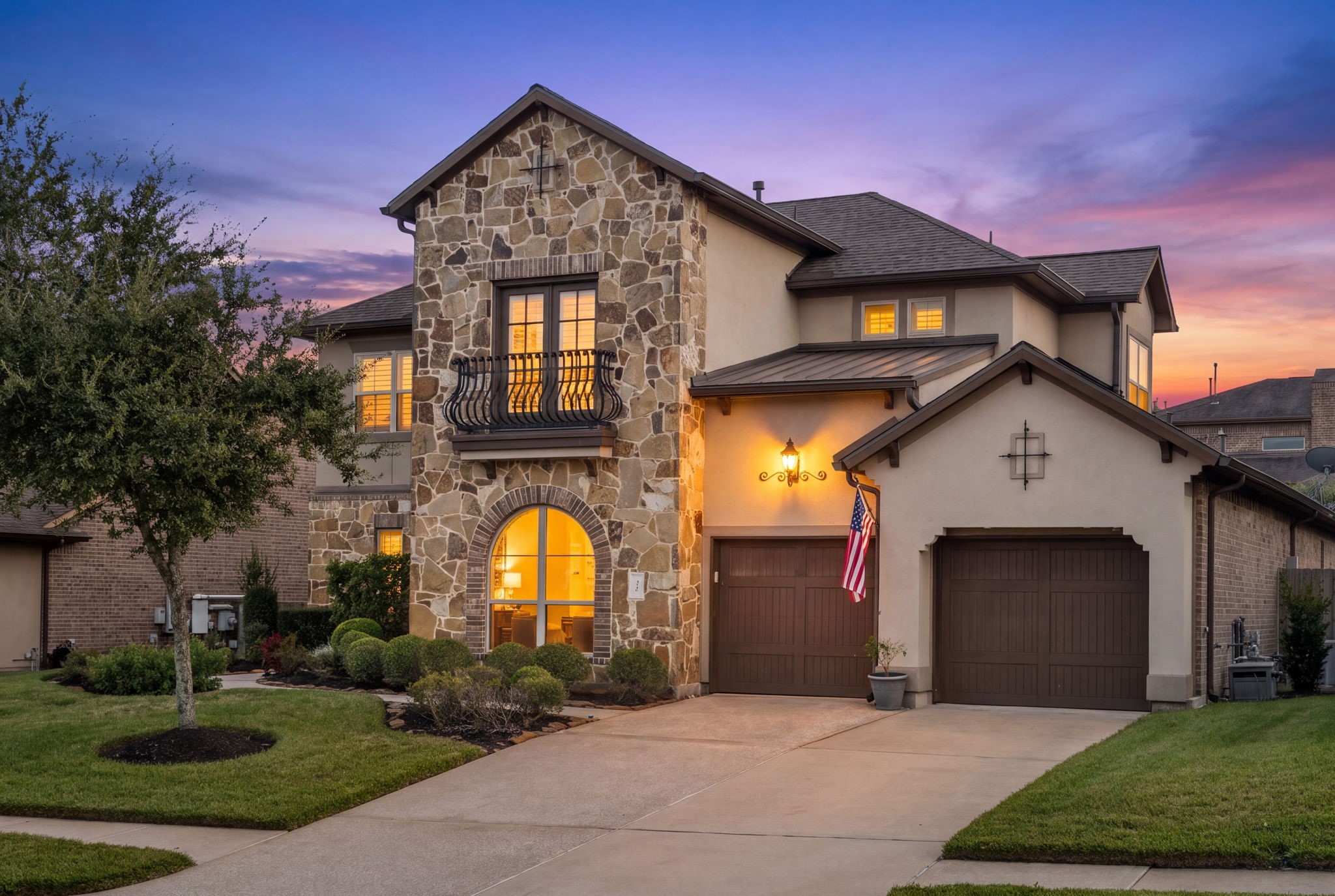 Beautifully maintained home with mature shade trees, manicured landscaping, and exceptional curb appeal.