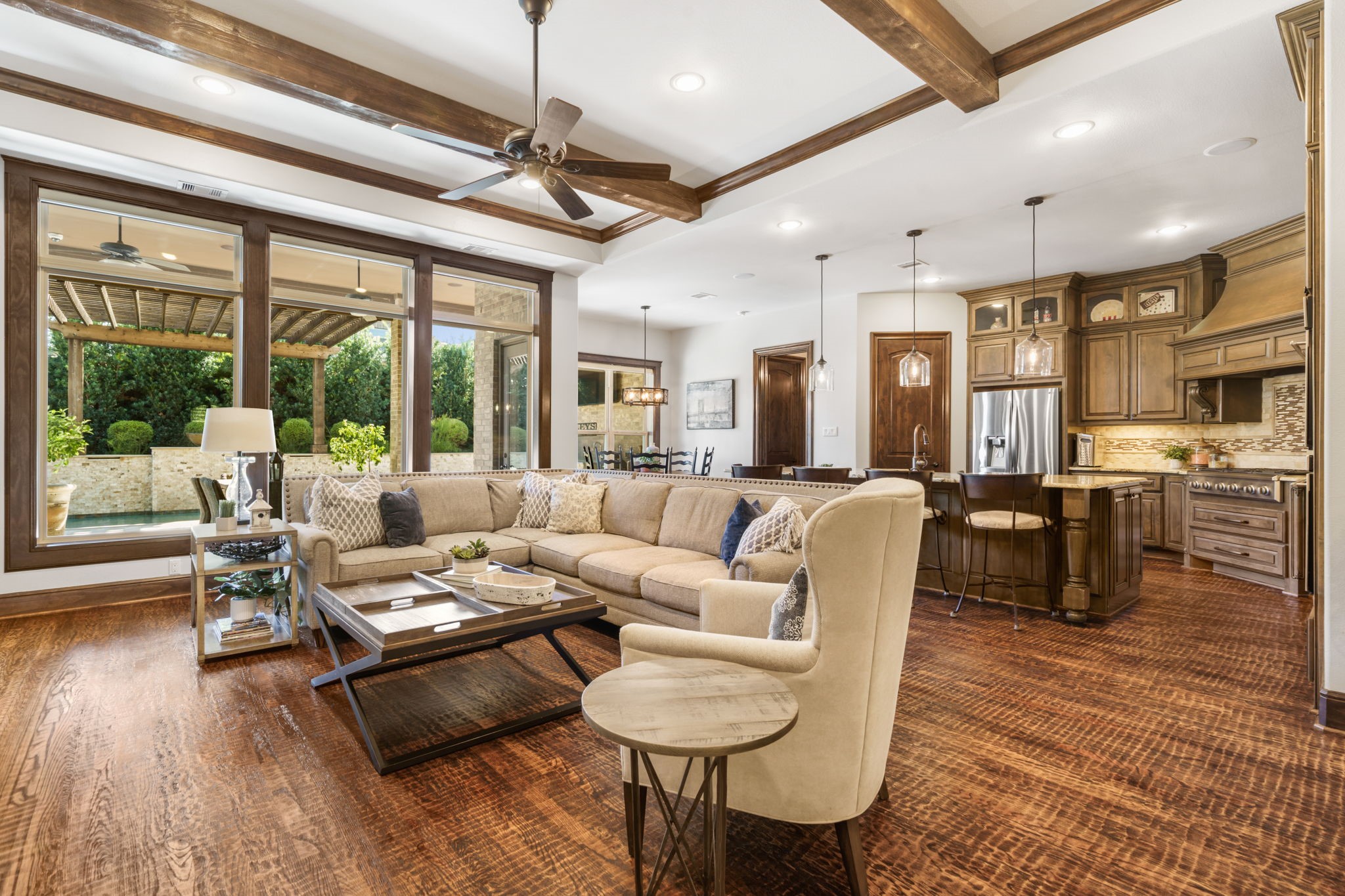 Expansive open-concept living area seamlessly connects the family room, kitchen, and breakfast area, creating an ideal space for everyday living and entertaining.