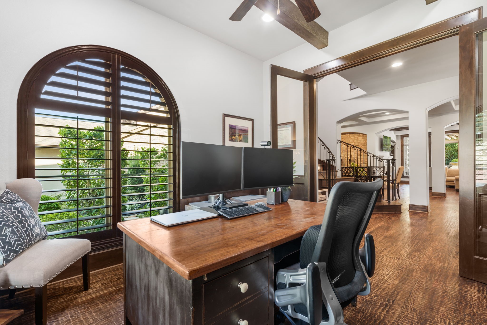 Glass-paneled French doors provide privacy while maintaining an open, connected feel to the home's main living areas.
