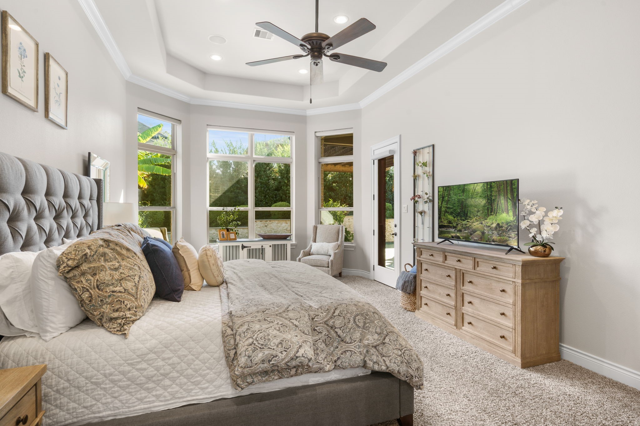A peaceful sitting area surrounded by windows offers the perfect place to unwind.
