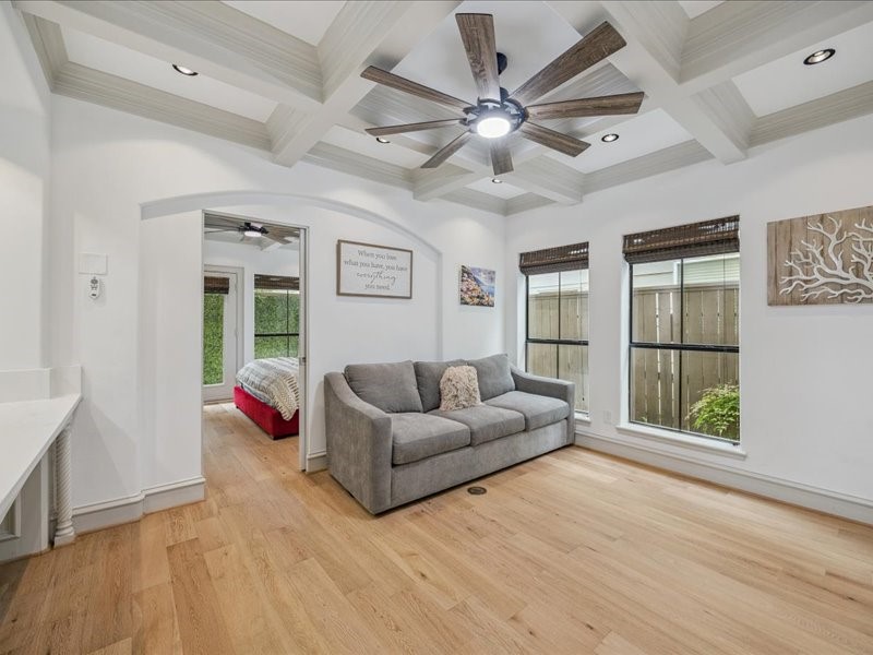 Relax, work, and stay organized in this inviting living area, featuring a built-in desk, a built-in dresser, and a spacious walk-in closet. Thoughtful storage keeps your essentials tucked away and your living space ready to enjoy!