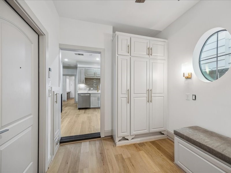 This inviting breakfast room sits between the kitchen and garage, featuring a built-in banquette, shelving, and extra storage. Just add a table for the perfect spot to enjoy morning coffee, casual meals, or dinner with friends!