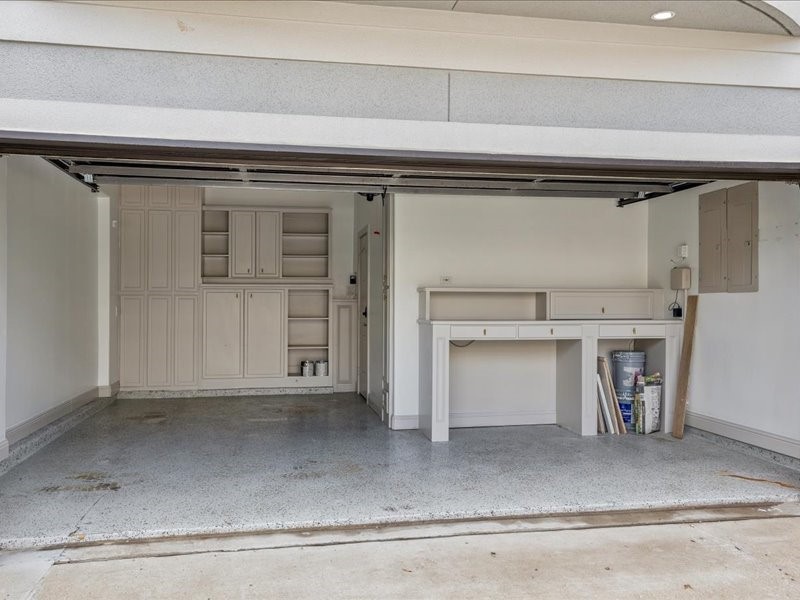 A place for everything! This garage view showcases storage along the entire back wall, a handy workbench, and additional shelving. From tools and hobby supplies to seasonal dcor, theres plenty of room to keep everything organized.
