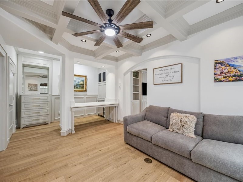 Relax, work, and stay organized in this inviting living area, featuring a built-in desk, a built-in dresser, and a spacious walk-in closet. Thoughtful storage keeps your essentials tucked away and your living space ready to enjoy!