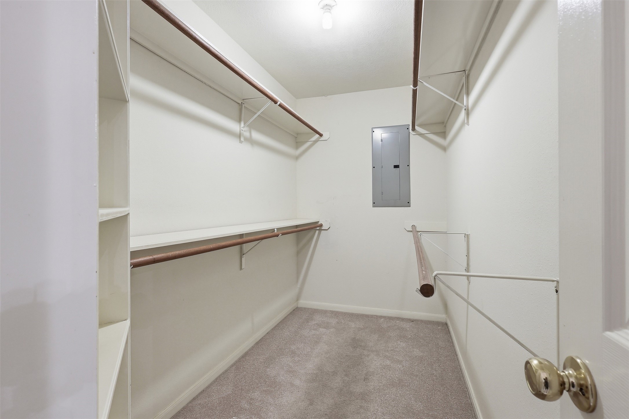 Generous storage with multiple hanging rods and built-in shelving & **NEW CARPET**