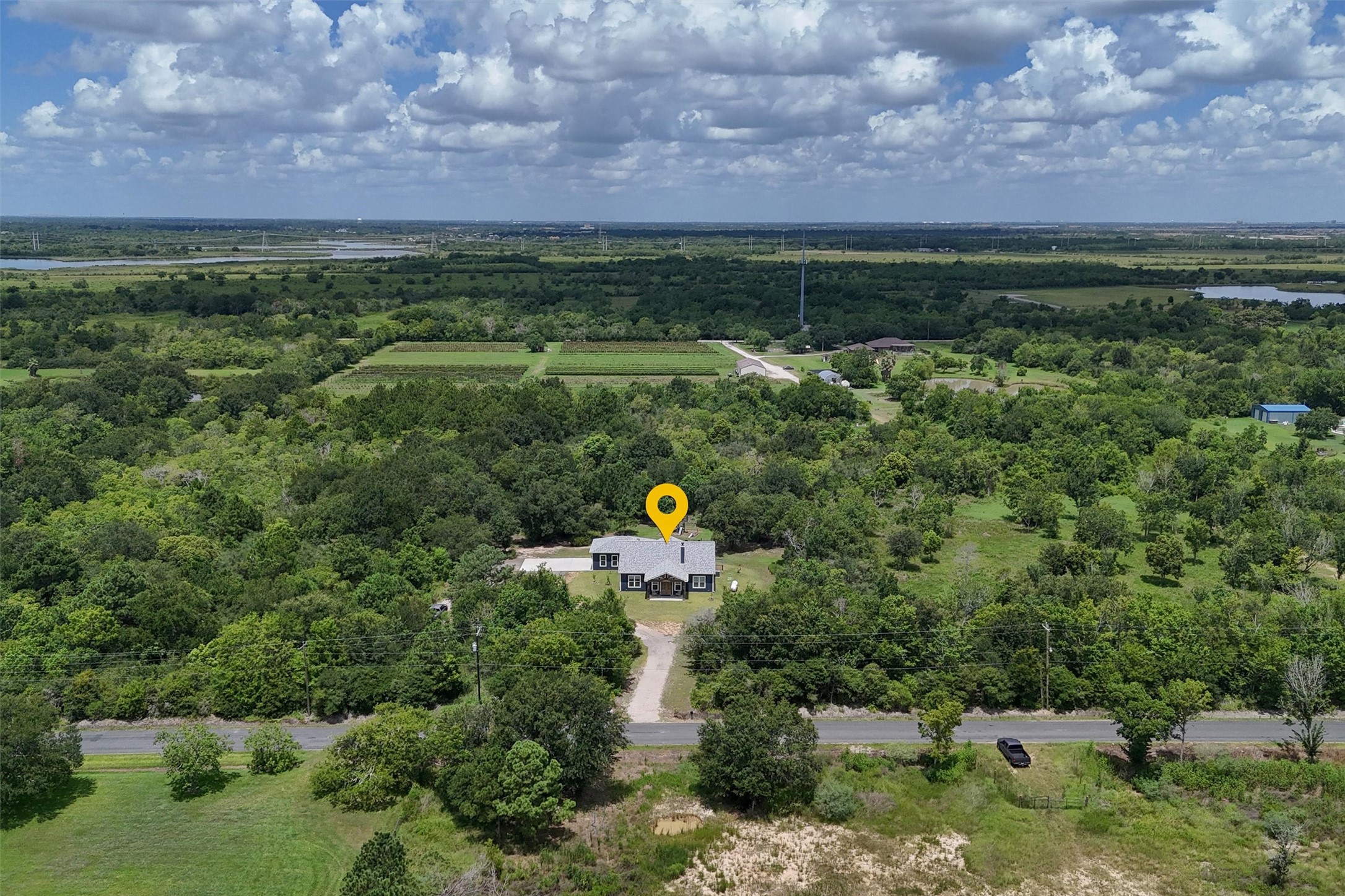 Overhead view of the front of the home. Primary backs up to an orchard and Galveston Bay!