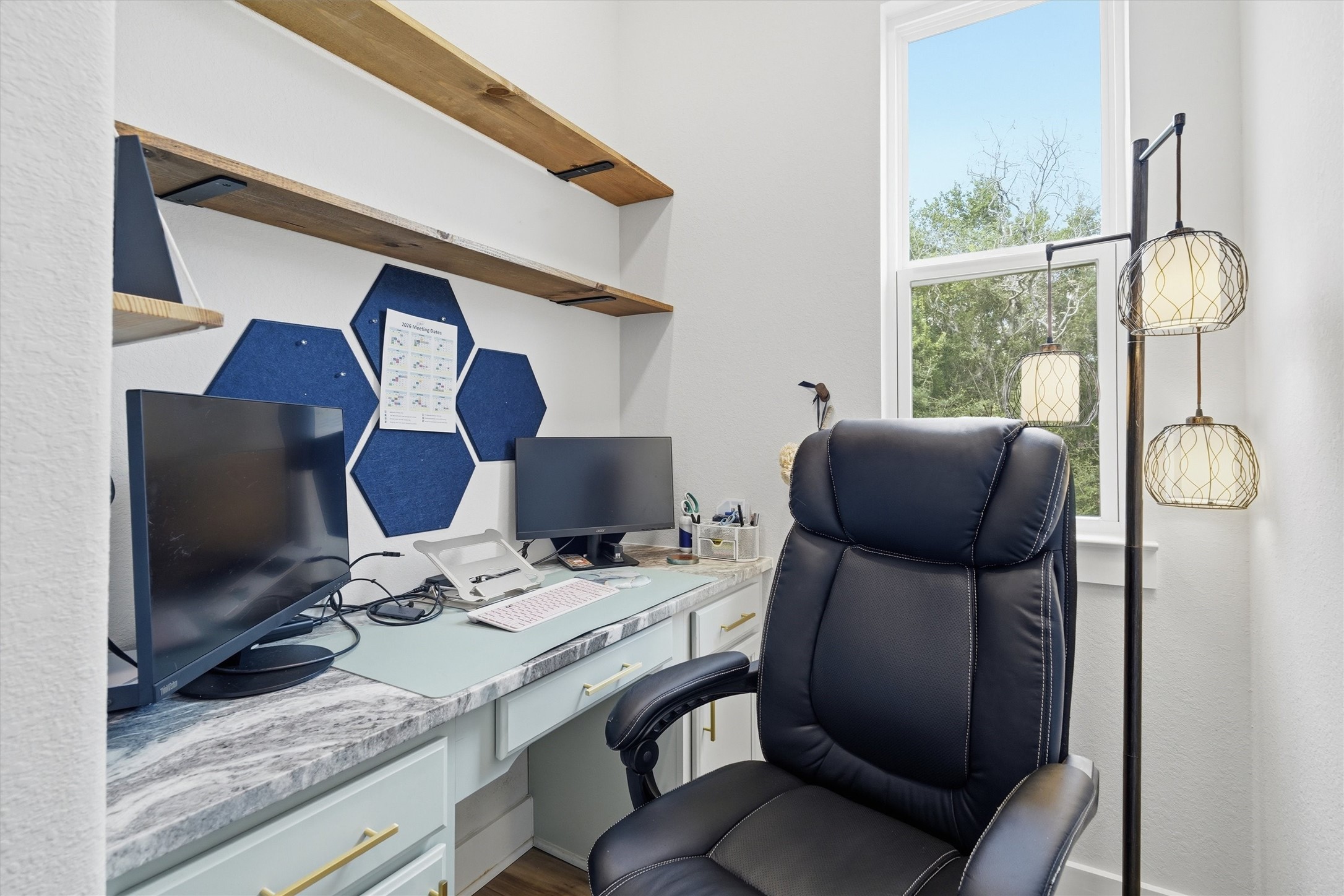 Office area with built ins, window overlooking side yard