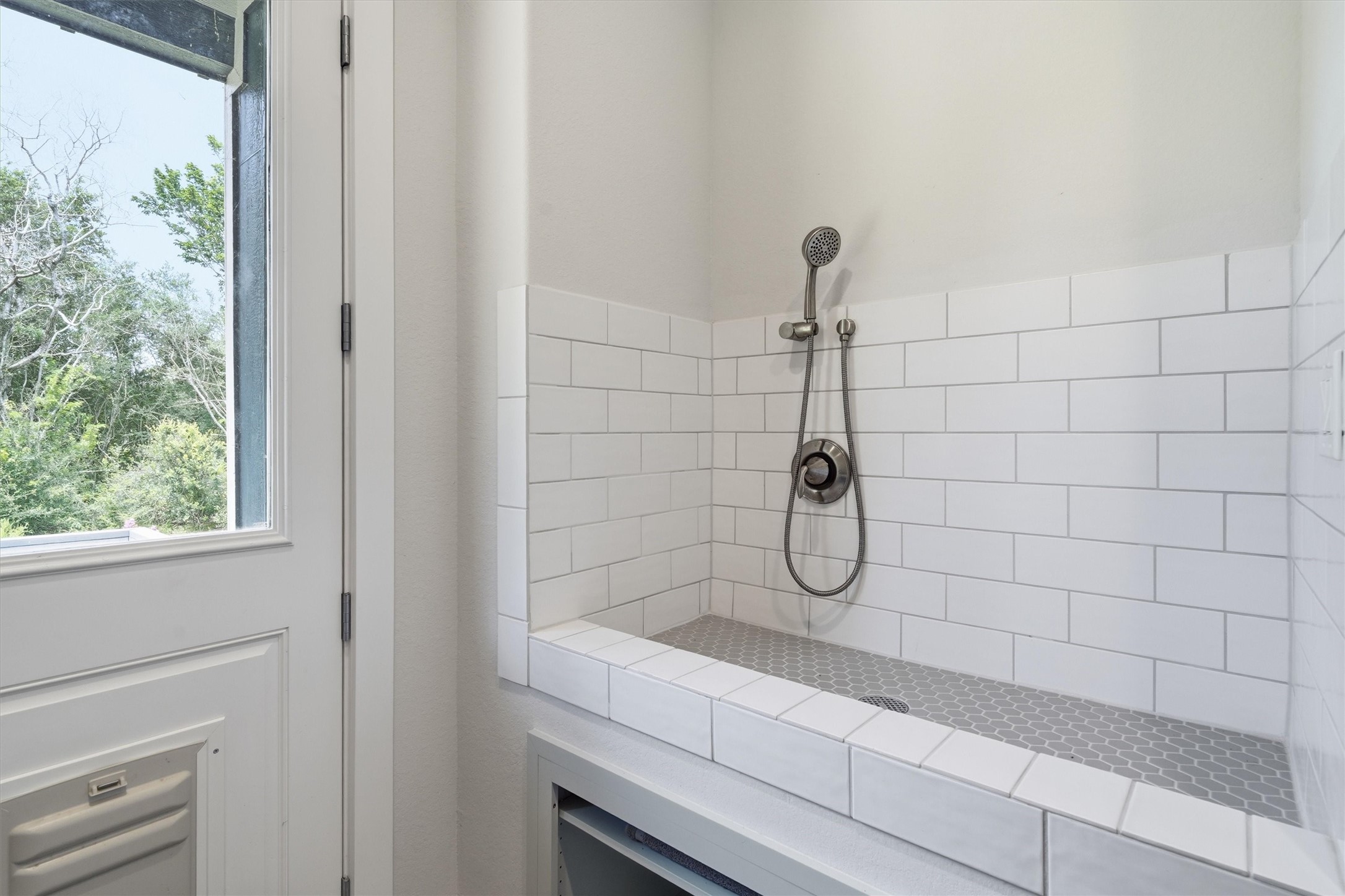 Fully tiled dog wash in the laundry room