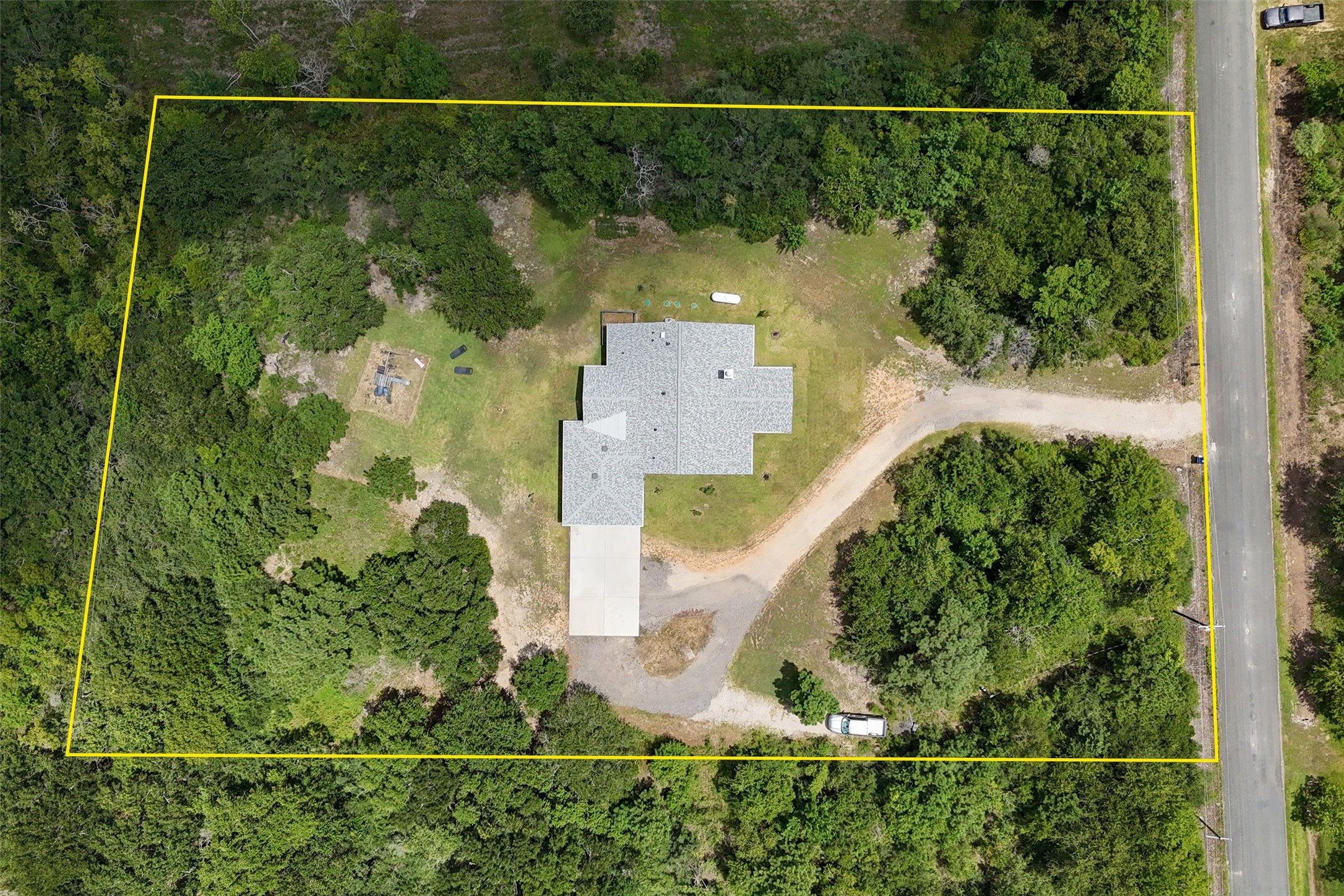 3/2/2 custom built in 2024, on 2 acres, complete with circle drive and RV hook up!
