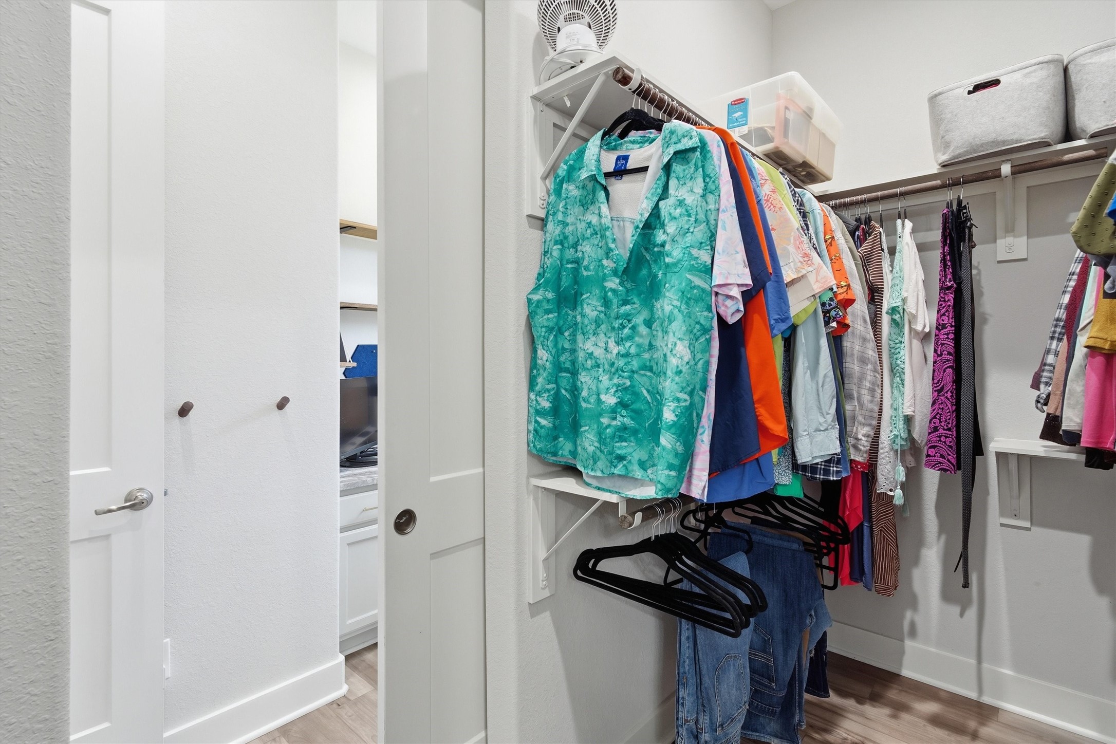 Primary walk in closet with easy access to the study/office, hallway and laundry room