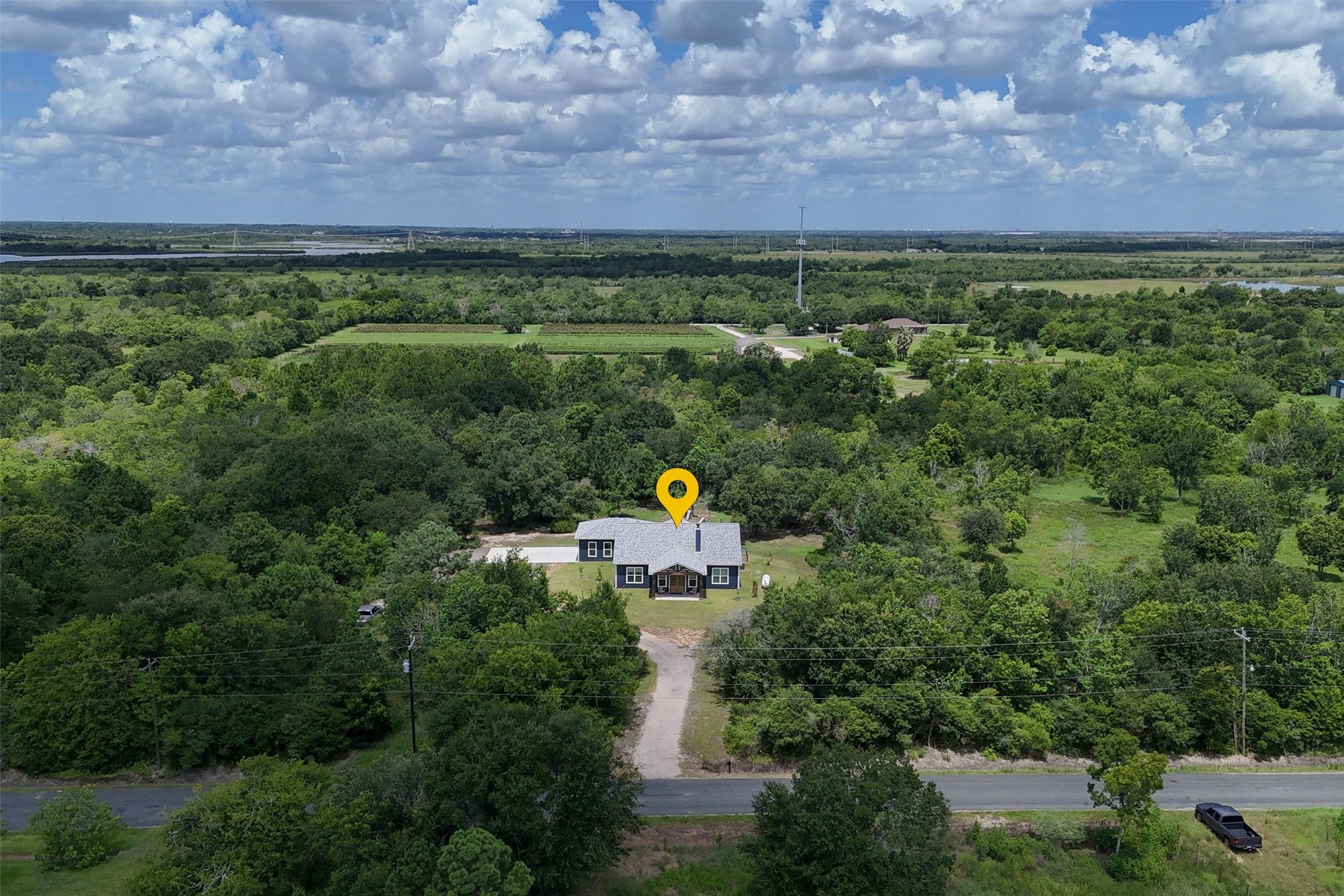 Overhead view of the front of the home. Primary backs up to an orchard and Galveston Bay!