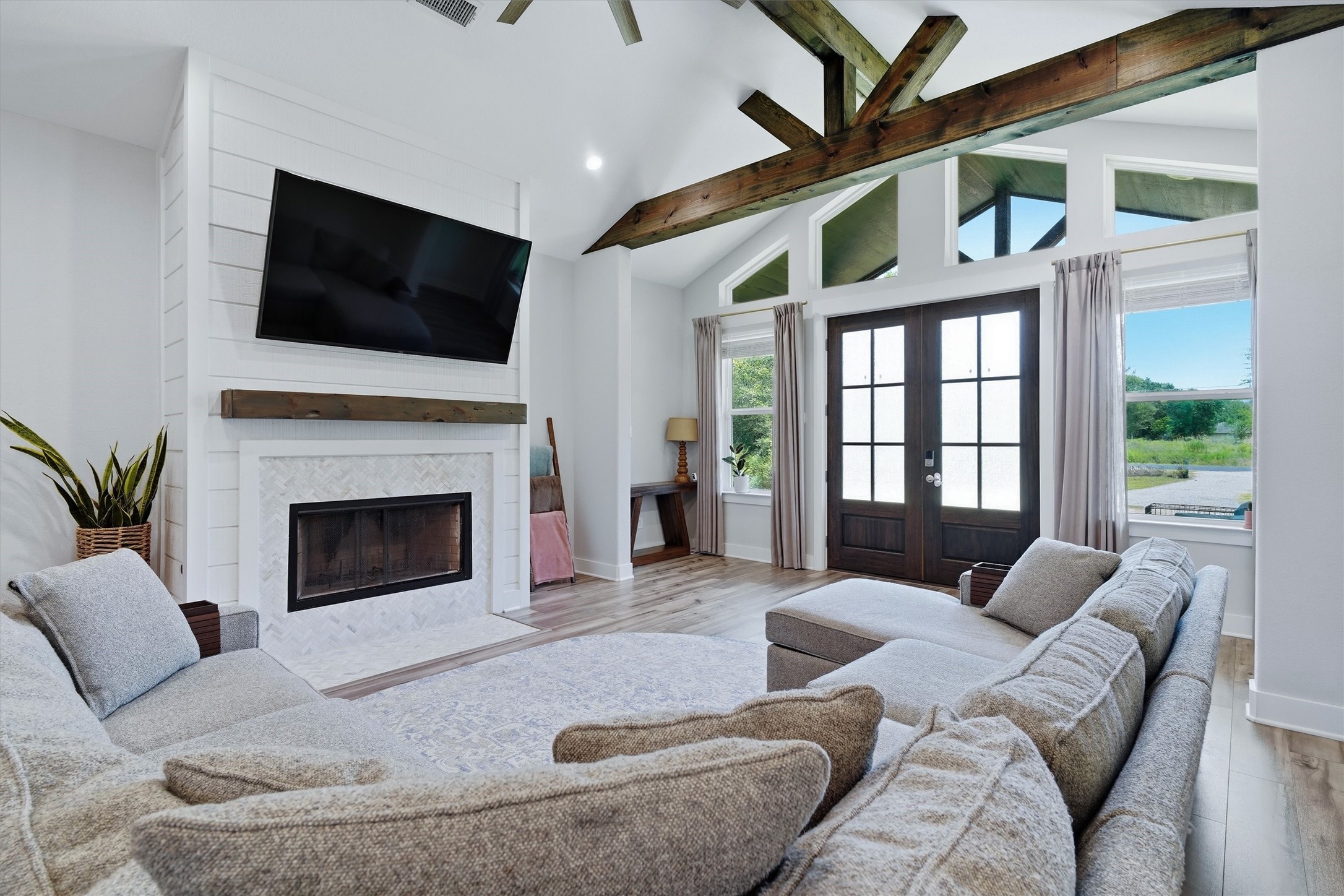 Beautiful fireplace, wood beam mantle. Texas sized windows letting in a ton of natual light!