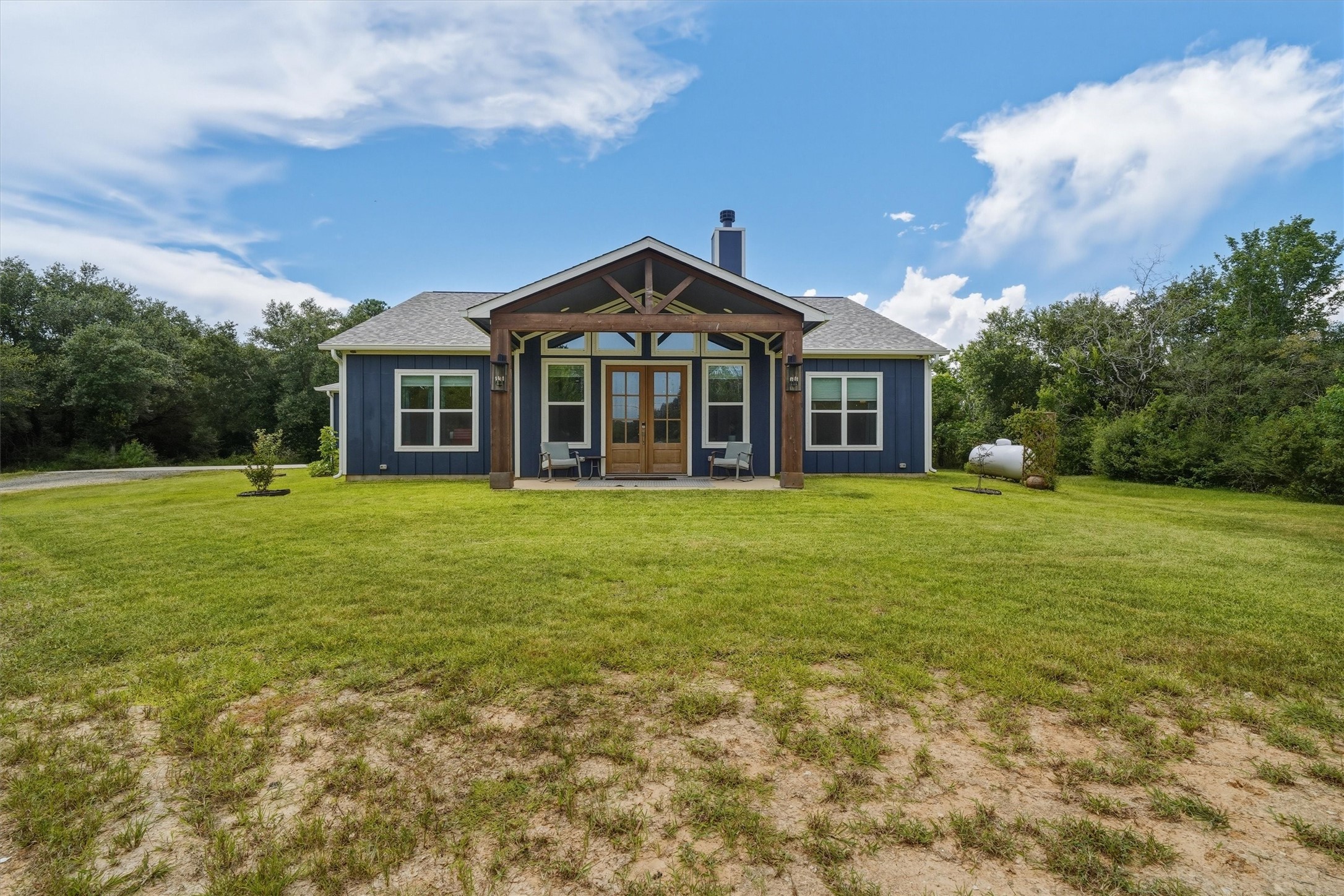 3/2/2 custom built in 2024, on 2 acres, complete with circle drive and RV hook up!