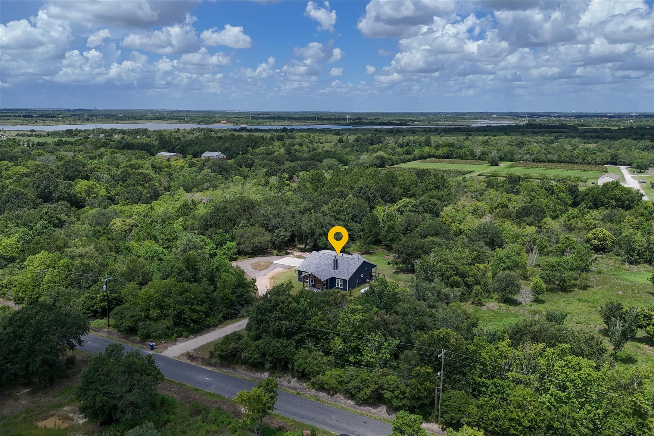 Overhead view of the front of the home. Primary backs up to an orchard and Galveston Bay!