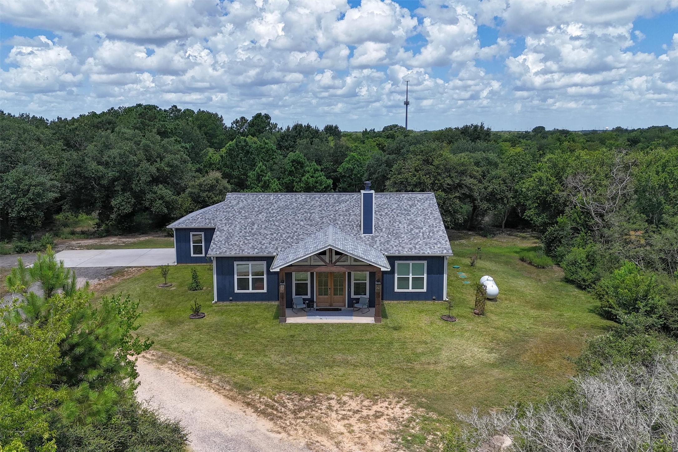 3/2/2 custom built in 2024, on 2 acres, complete with circle drive and RV hook up!