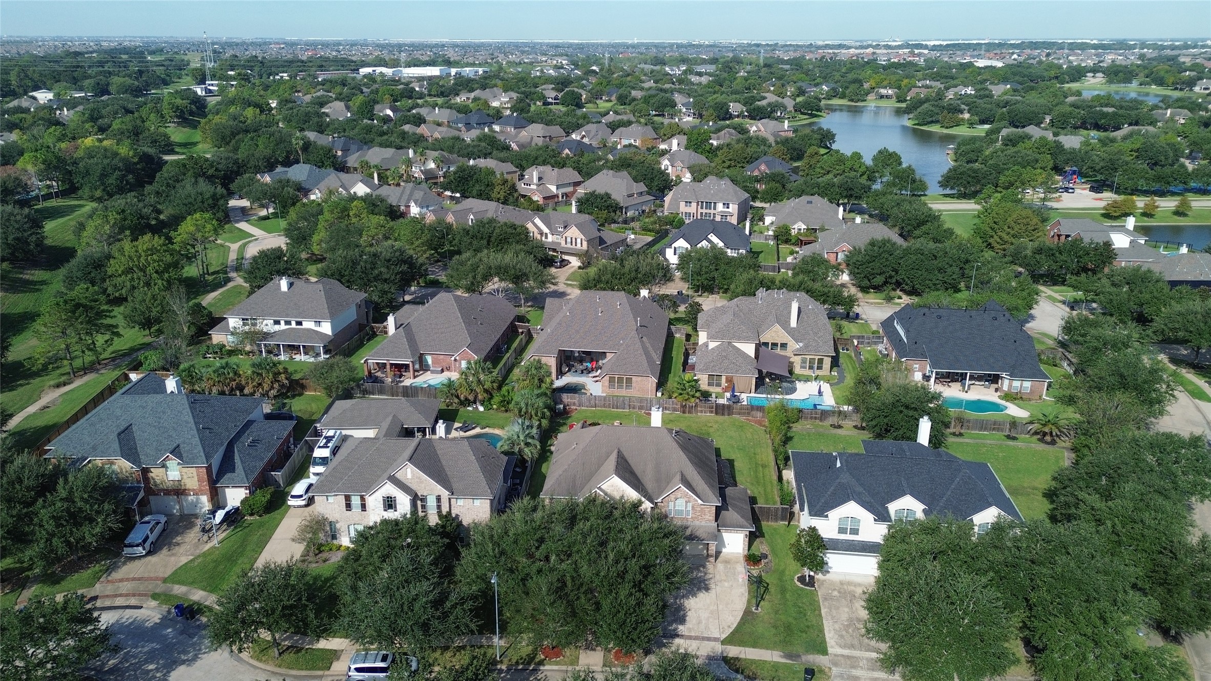 Charming neighborhood with spacious homes, lush greenery, and nearby water views, offering a serene and picturesque setting.