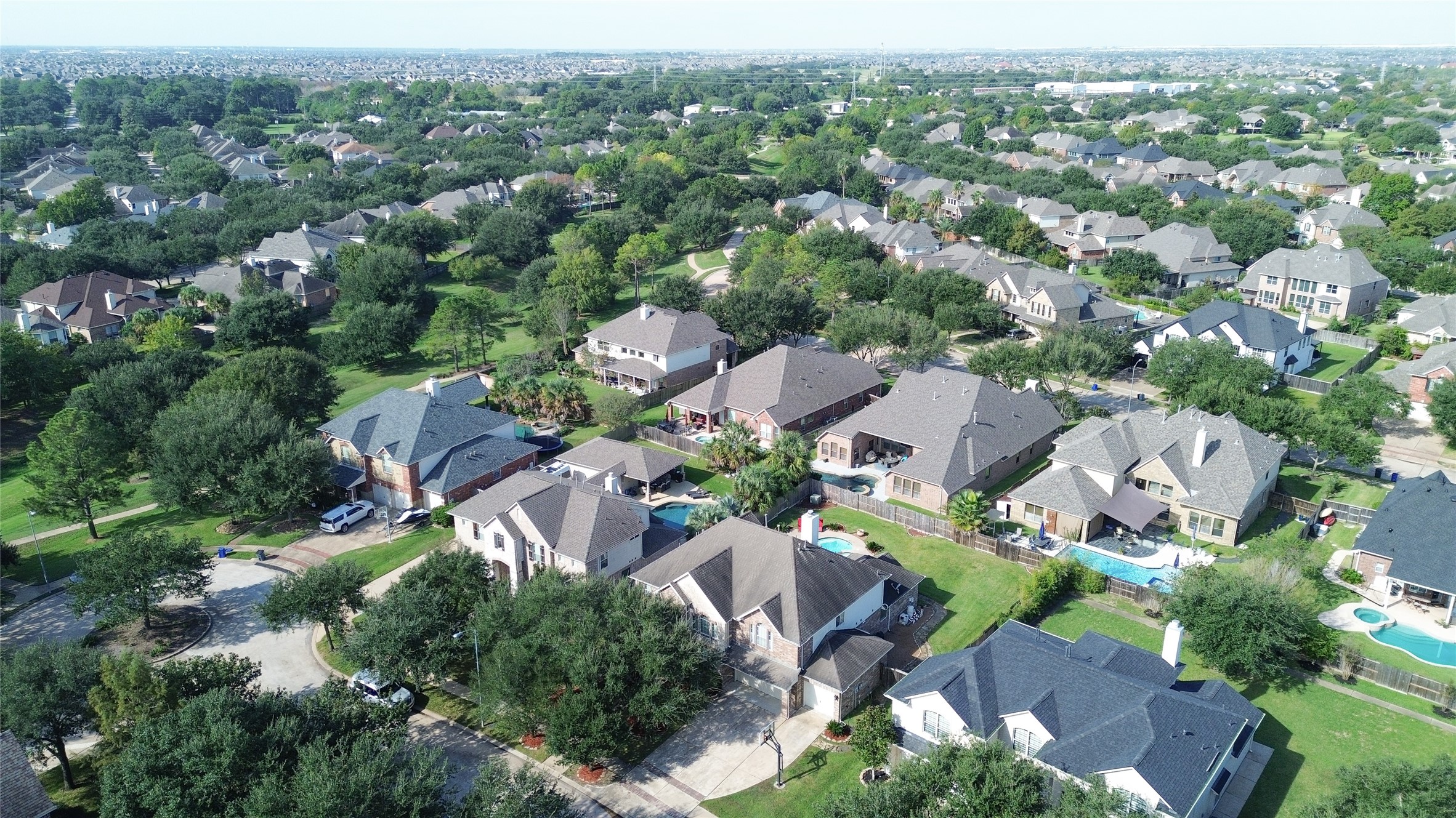 Nestled in a lush, tree-lined neighborhood, this community features spacious homes with private pools, offering a serene suburban lifestyle just a short drive from urban conveniences.