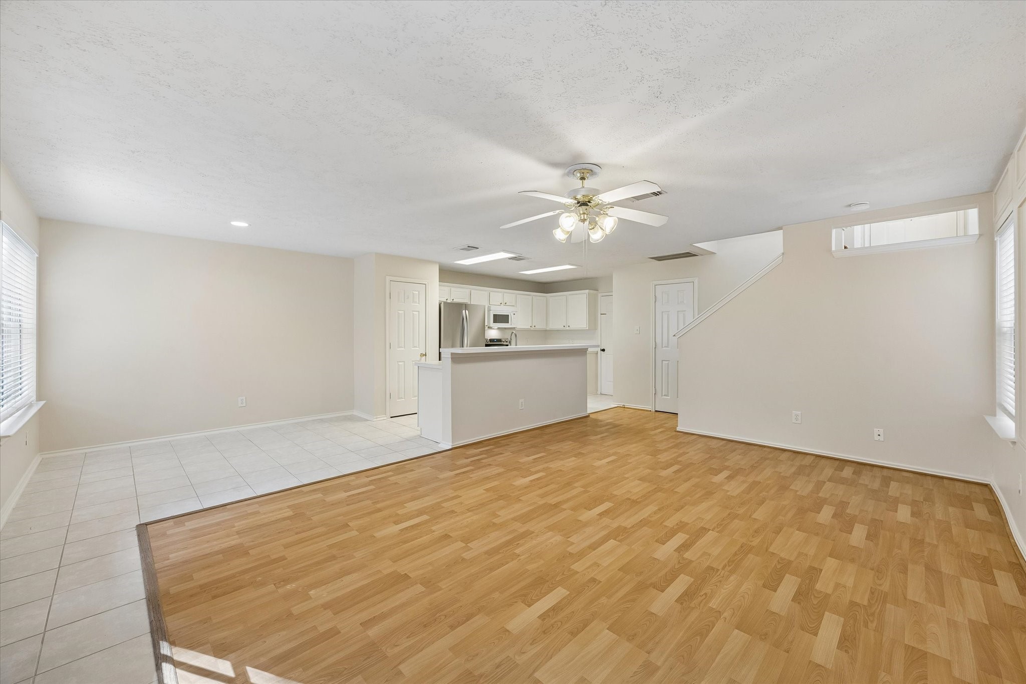 Large open family room with open kitchen and breakfast areas.