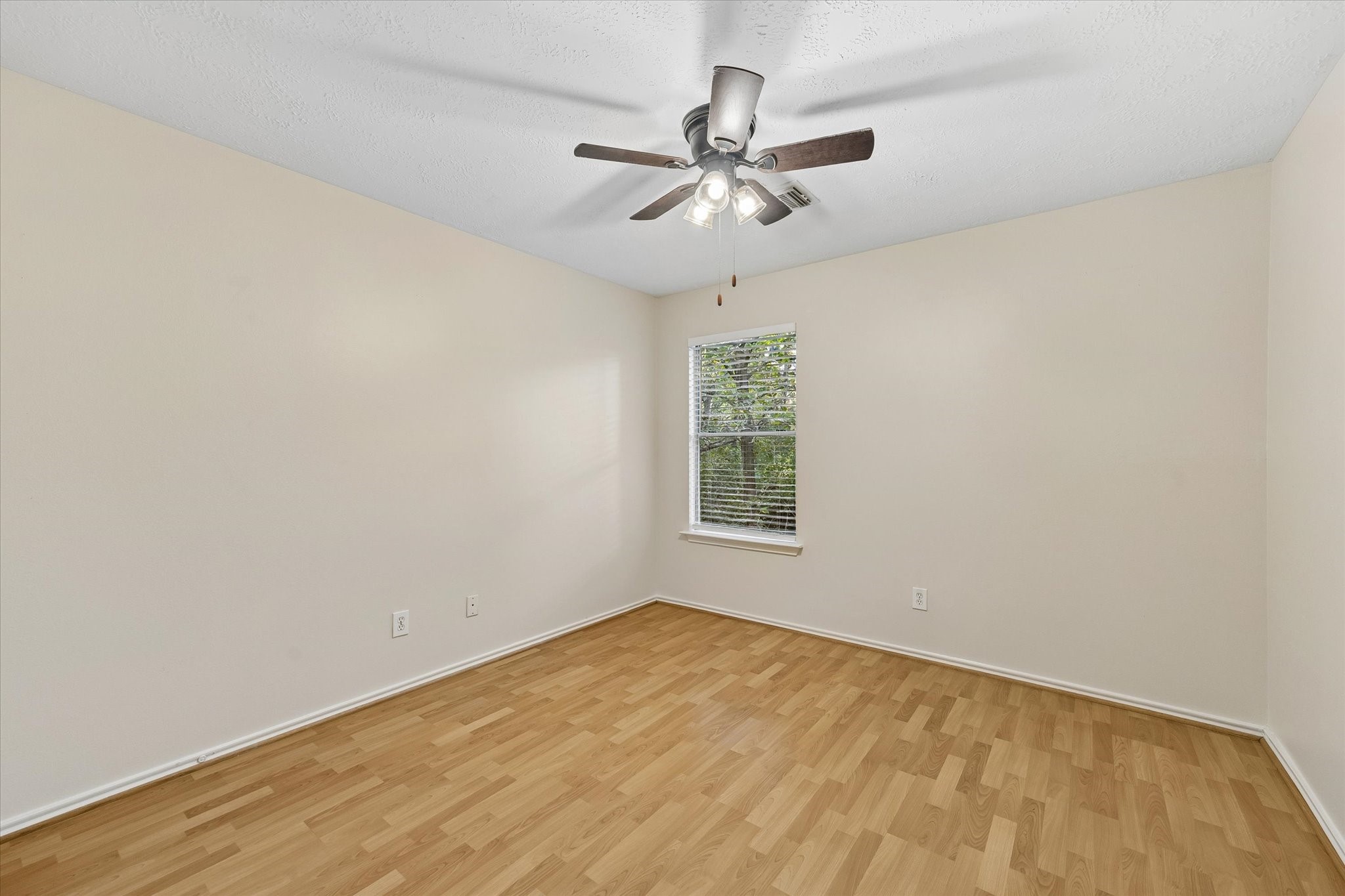 The secondary bedrooms are similar in size with great closets and backyard views!