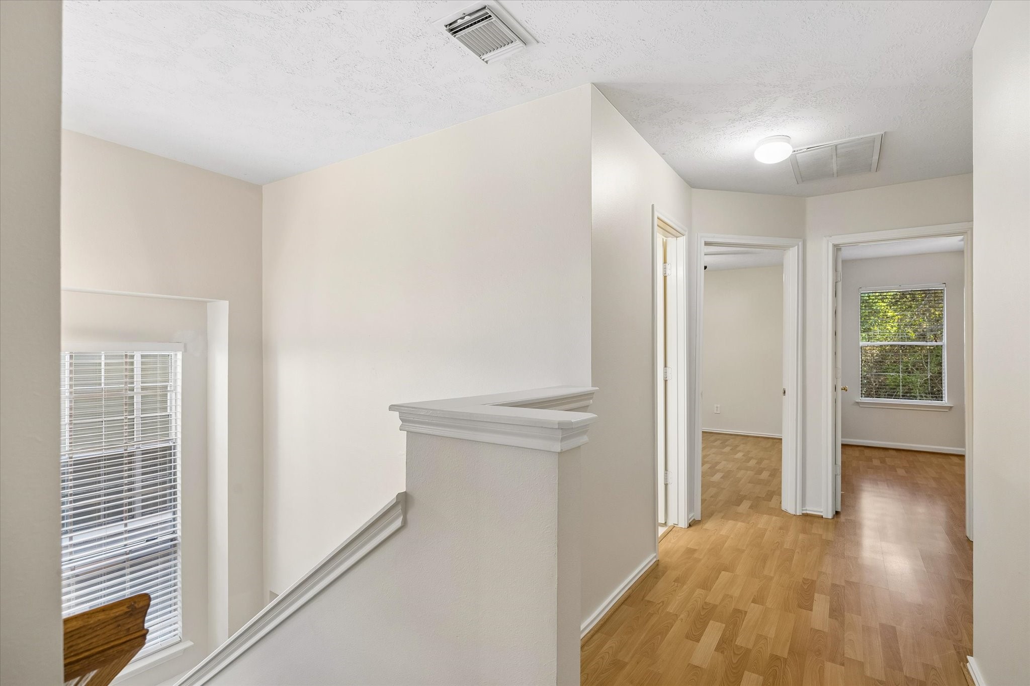 The other two bedrooms, bath and laundry are just down the hall.