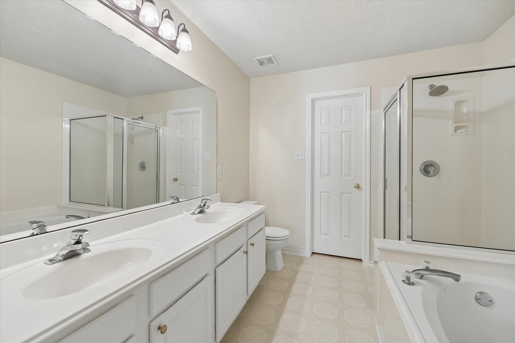 Double sinks, separate tub and shower.