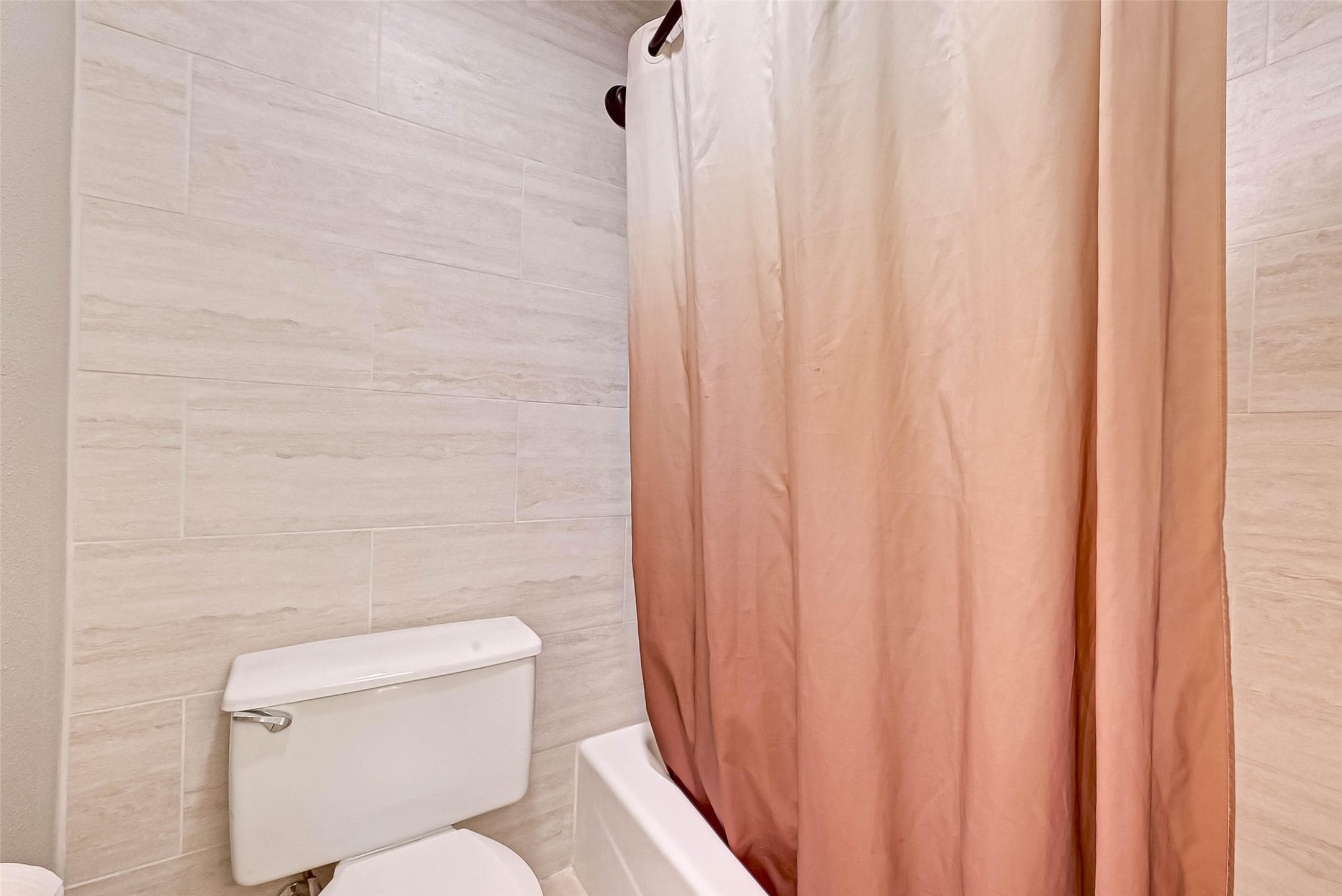 Bathtub/shower in primary bath.