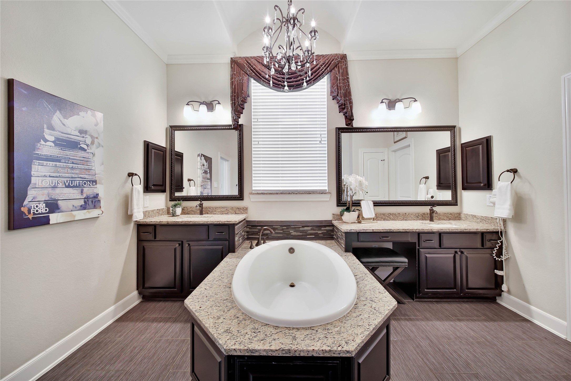 The primary retreat features dual vanities and a soothing soaking tub, creating a spa-like space.