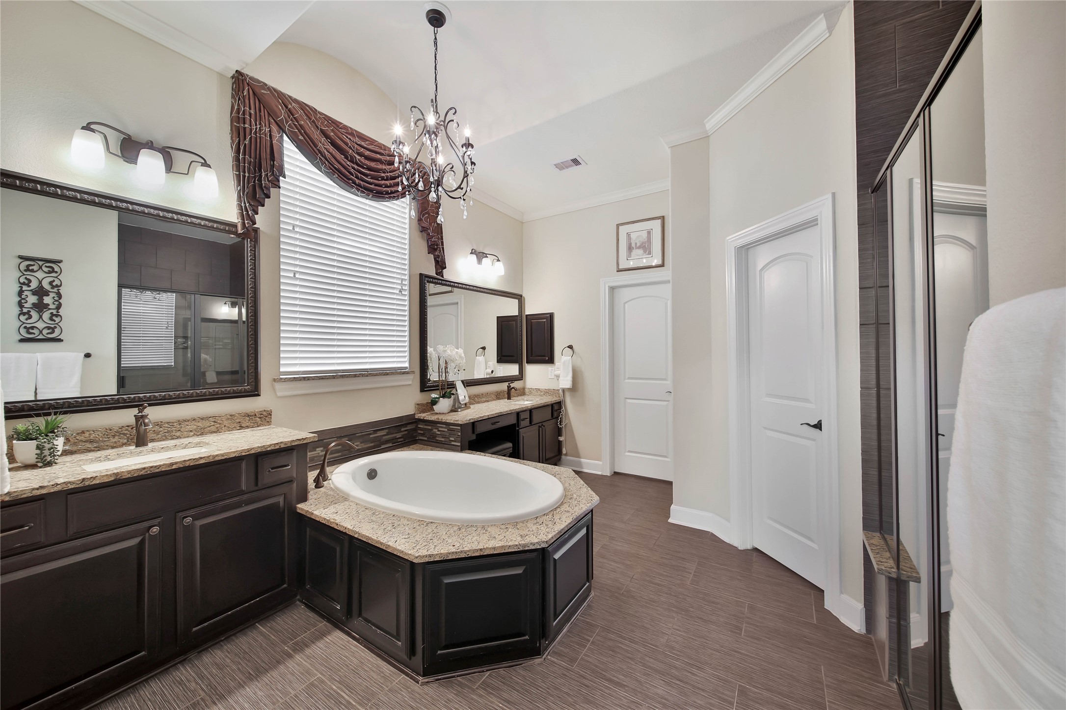 Natural materials and neutral colors add subtle elegance to the primary bath.