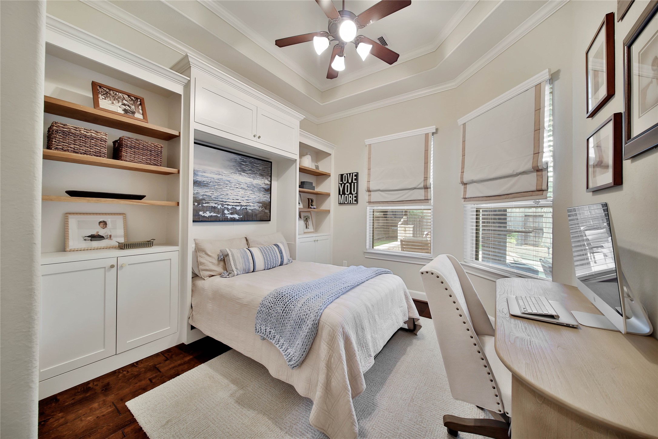 The home office/study features a built-in Murphy bed, offering flexible space that can easily transform into a 5th bedroom when needed.