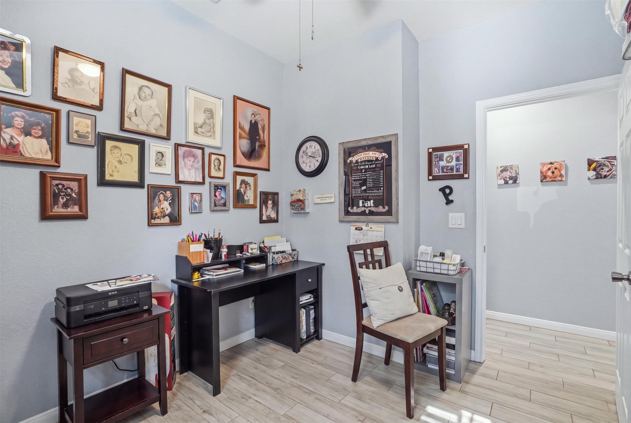 Cozy home office/bedroom with ample wall space for personal touches.