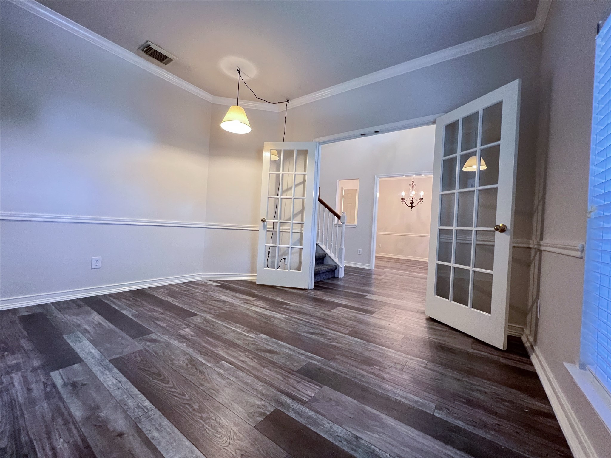 Elevate your work-from-home experience in this elegant study, featuring rich flooring, stylish French doors, and abundant natural light. Elevate your work-from-home experience in this elegant study, featuring rich flooring, stylish French doors, and abundant natural light.