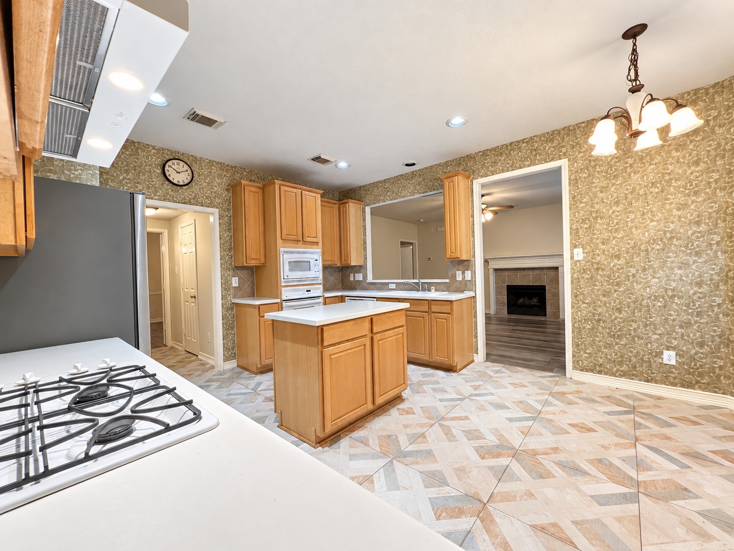 Spacious kitchen with elegant cabinetry, modern appliances, and a cozy connection to the living area, perfect for both cooking and entertaining.