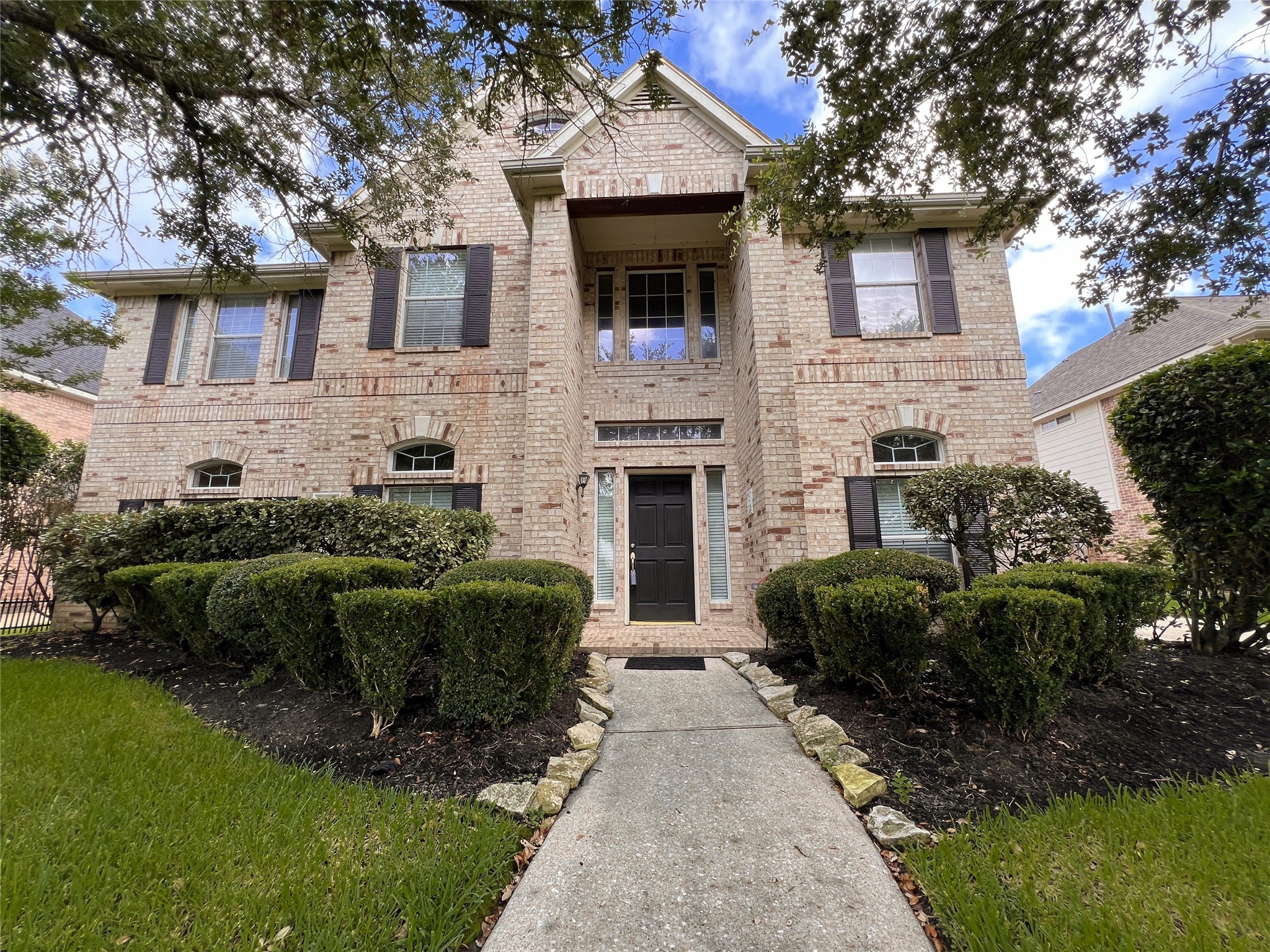 Step into elegance with this charming brick home, where inviting curb appeal and a welcoming entrance say "welcome home.