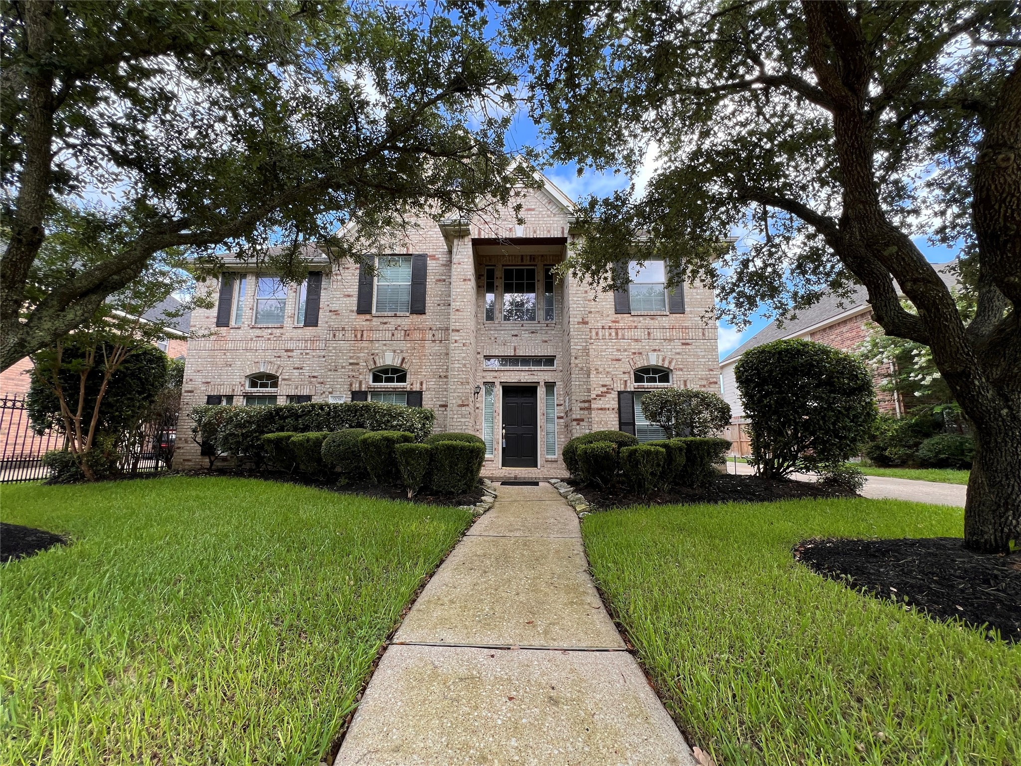 Discover timeless elegance in this stunning brick home, framed by mature trees and lush landscaping, offering a warm and inviting welcome. Discover timeless elegance in this stunning brick home, framed by mature trees and lush landscaping, offering a warm and inviting welcome.