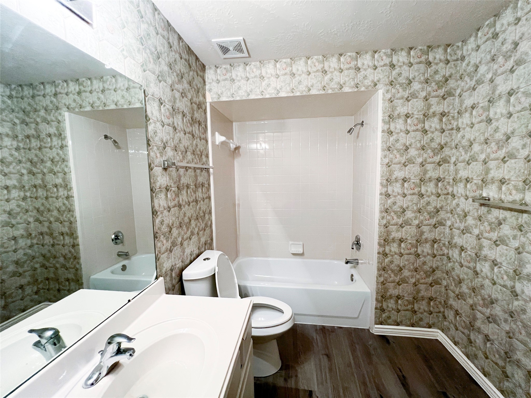 Second-floor bathroom featuring a stylish blend of classic tilework and modern fixtures for a refreshing retreat.