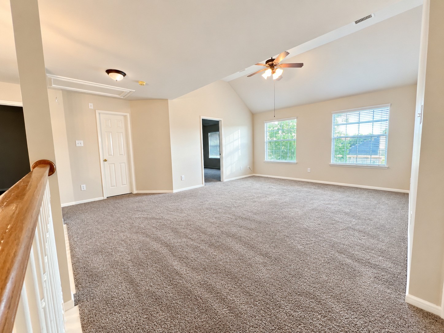 Spacious and inviting, this second-floor game room offers the perfect setting for entertainment and relaxation.