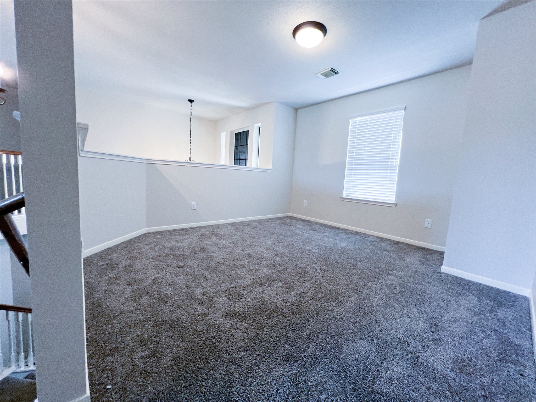 Discover the cozy charm of a second-floor sitting area, perfect for relaxation or a quiet retreat.