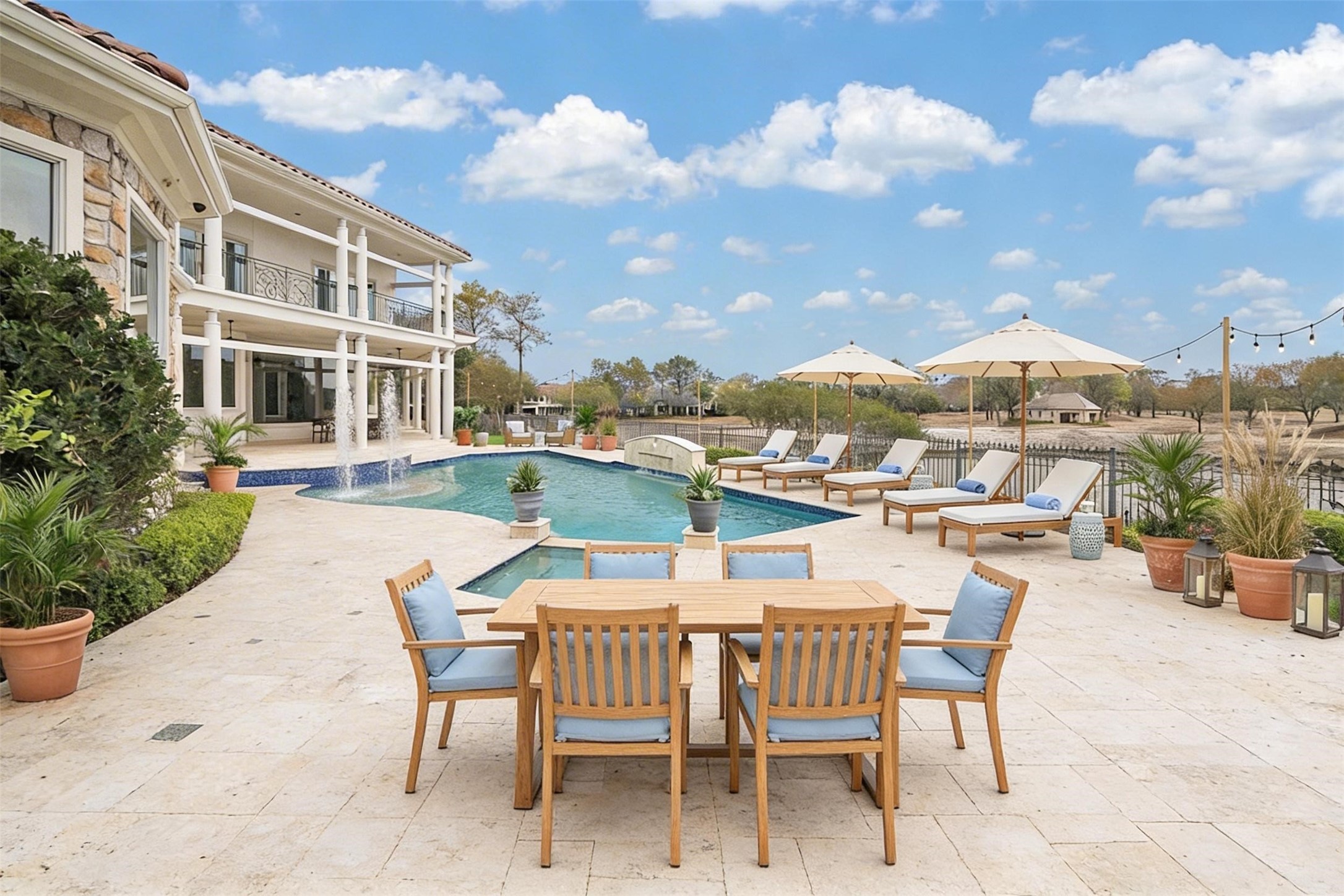 VIRTUALLY STAGED - enjoy relaxing and dining on the large open terrace around the pool/spa